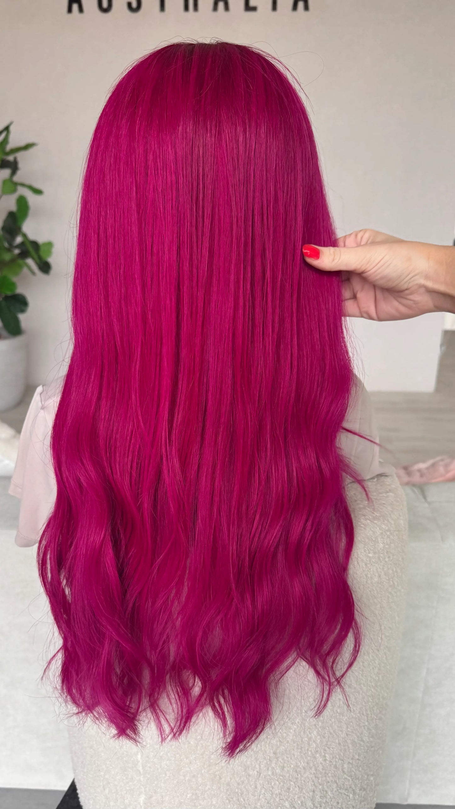 back view 24 inch pink hair, holding the long hair.