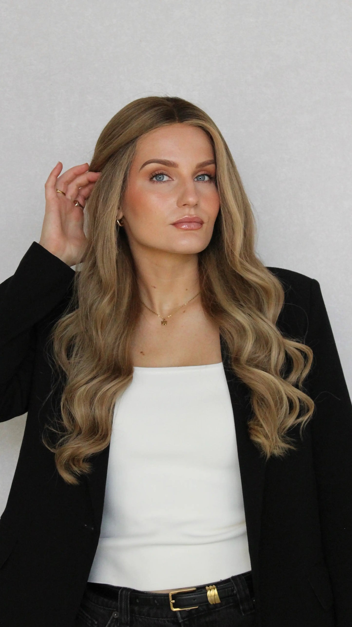 form front view, pulling hair out of face, natural lacefront human hair wig, brazilian remy hair, natural hairlline, able to tuck and tie up. australia wigs.