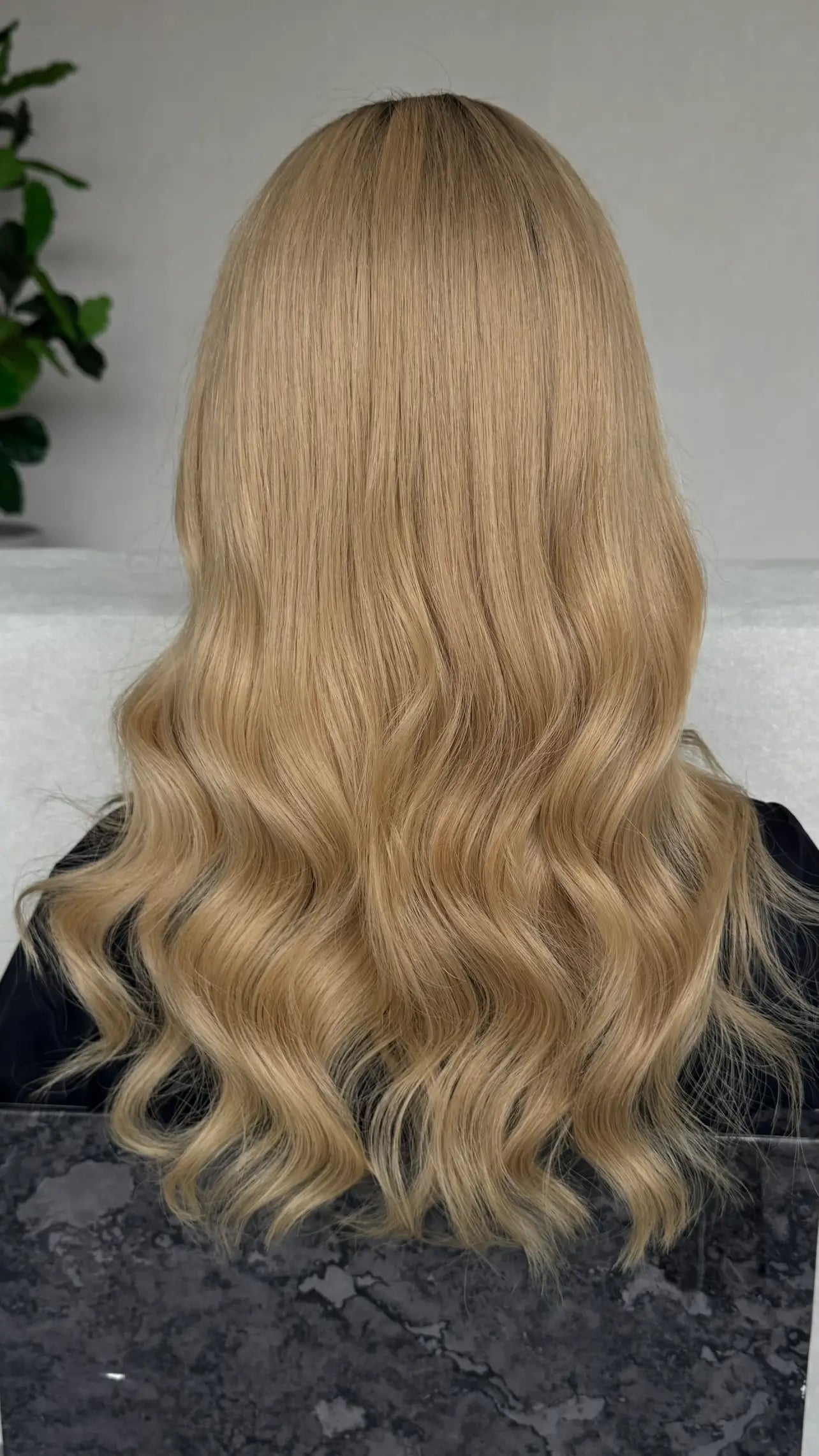 golden blonde hair from the back , light waves throughout.