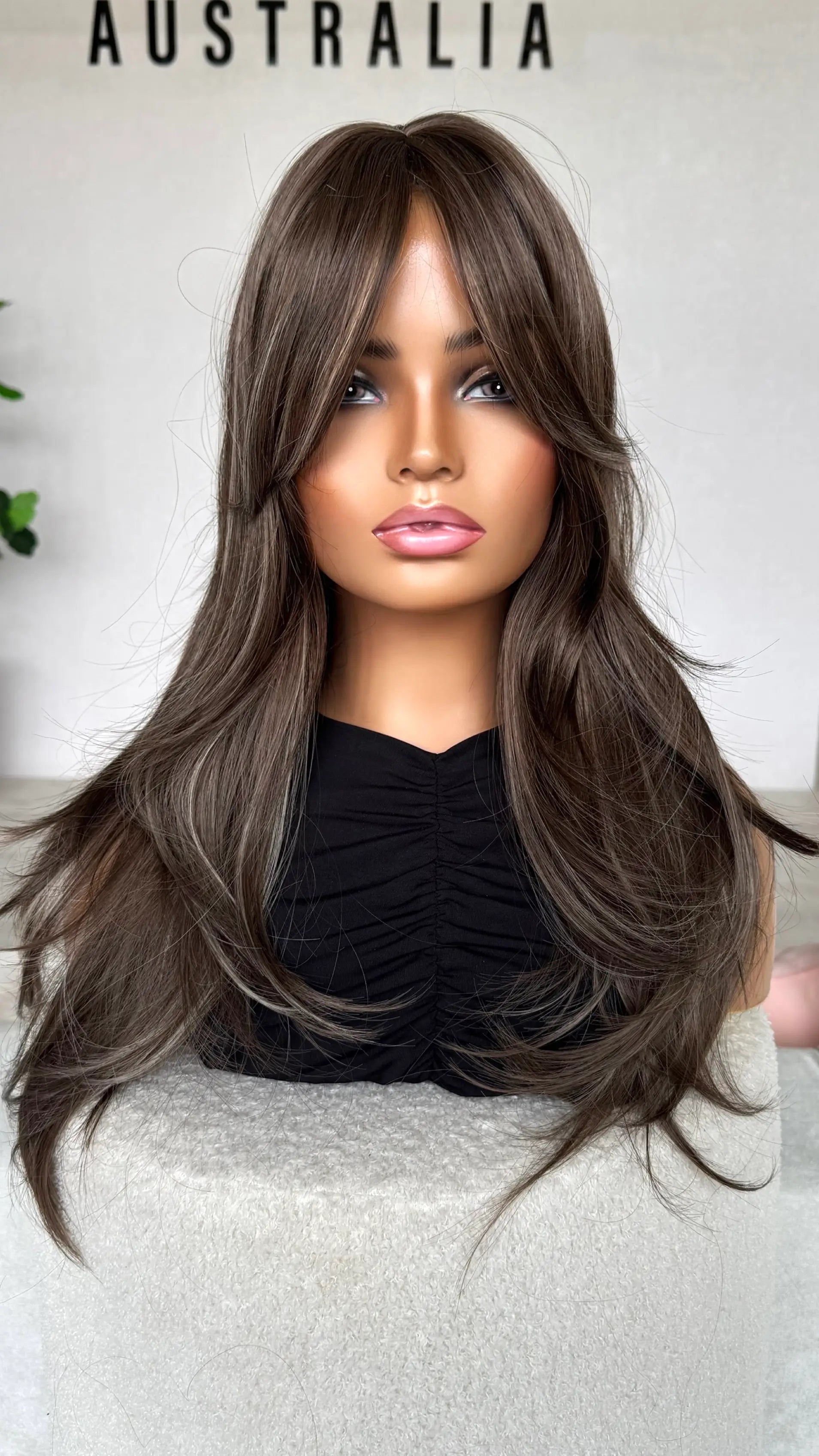ash brunette hair with highlights front view.