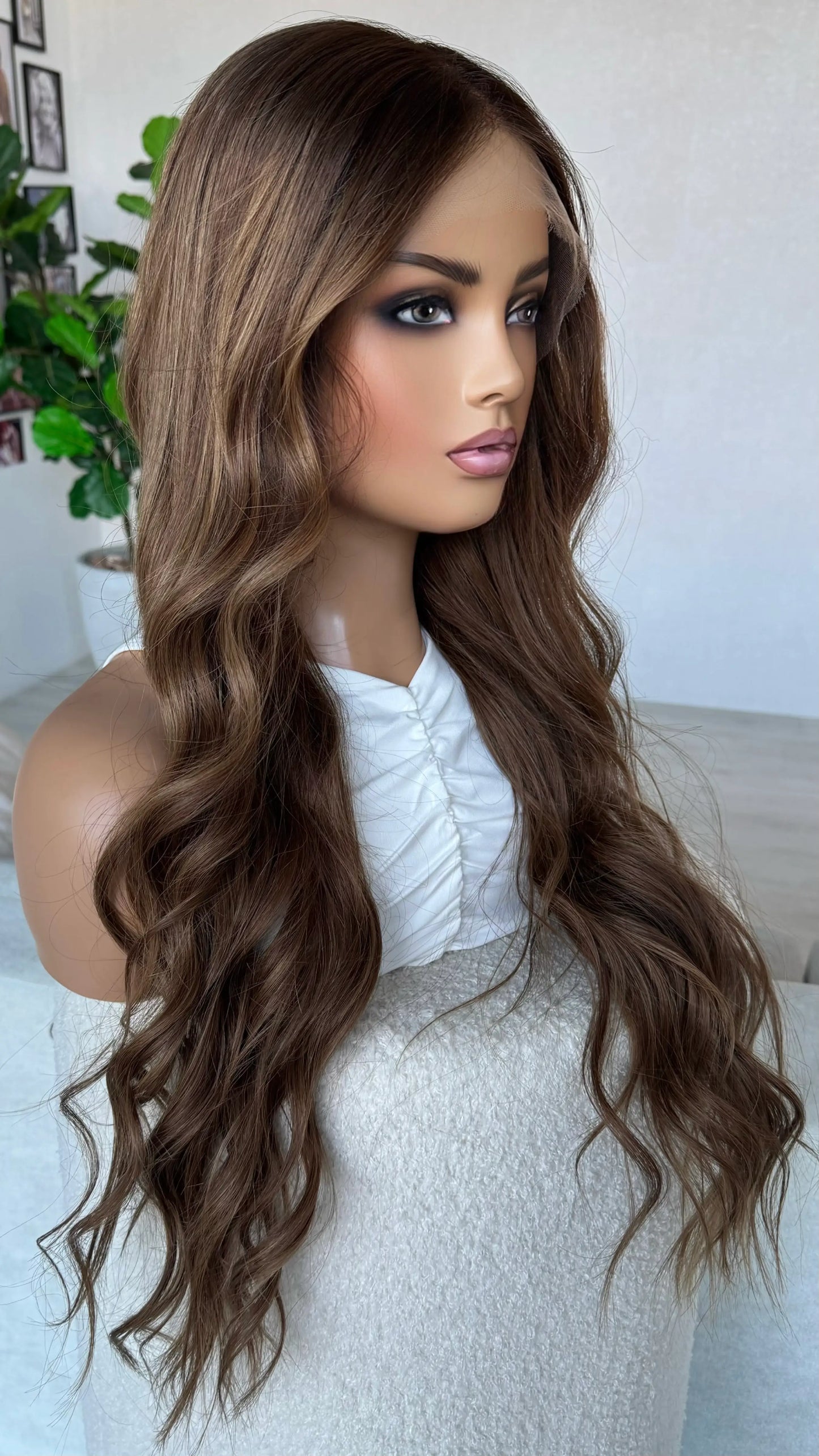 side on view middle part, slight darker root to softr brunette tones.