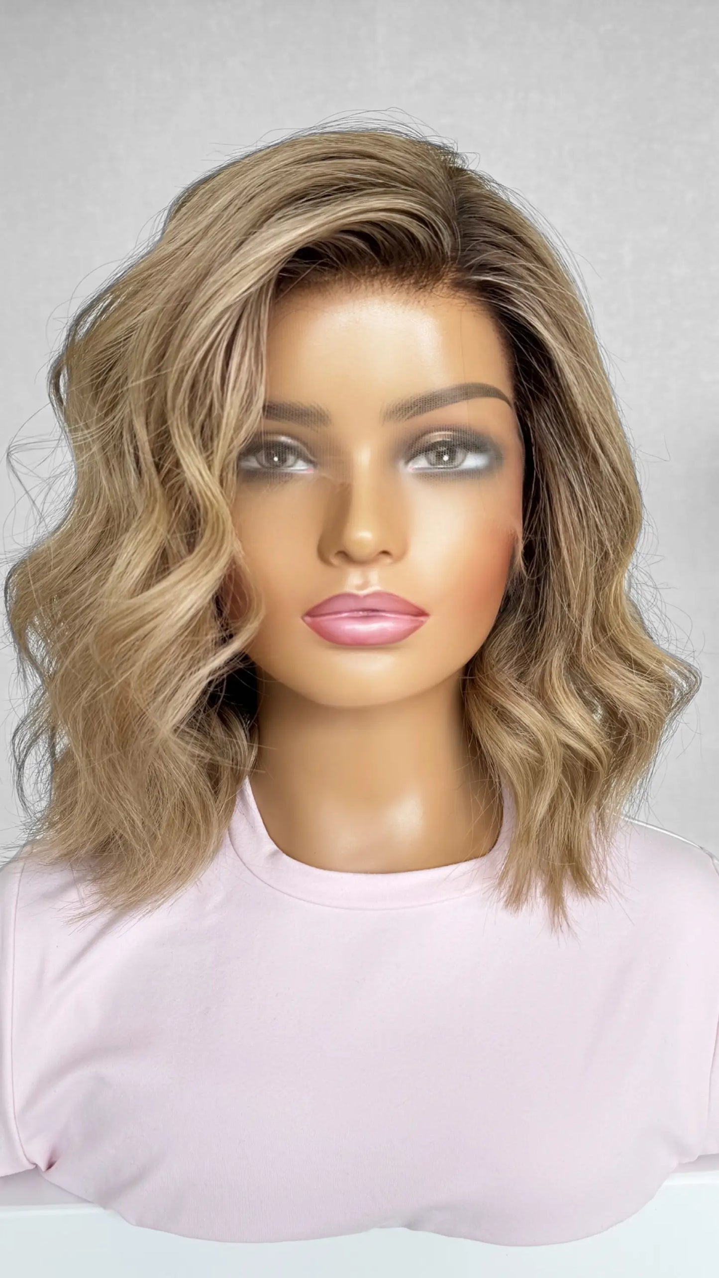 A 14-inch human hair lace front wig in warm blonde with soft highlights, offering a sun-kissed glow and natural movement