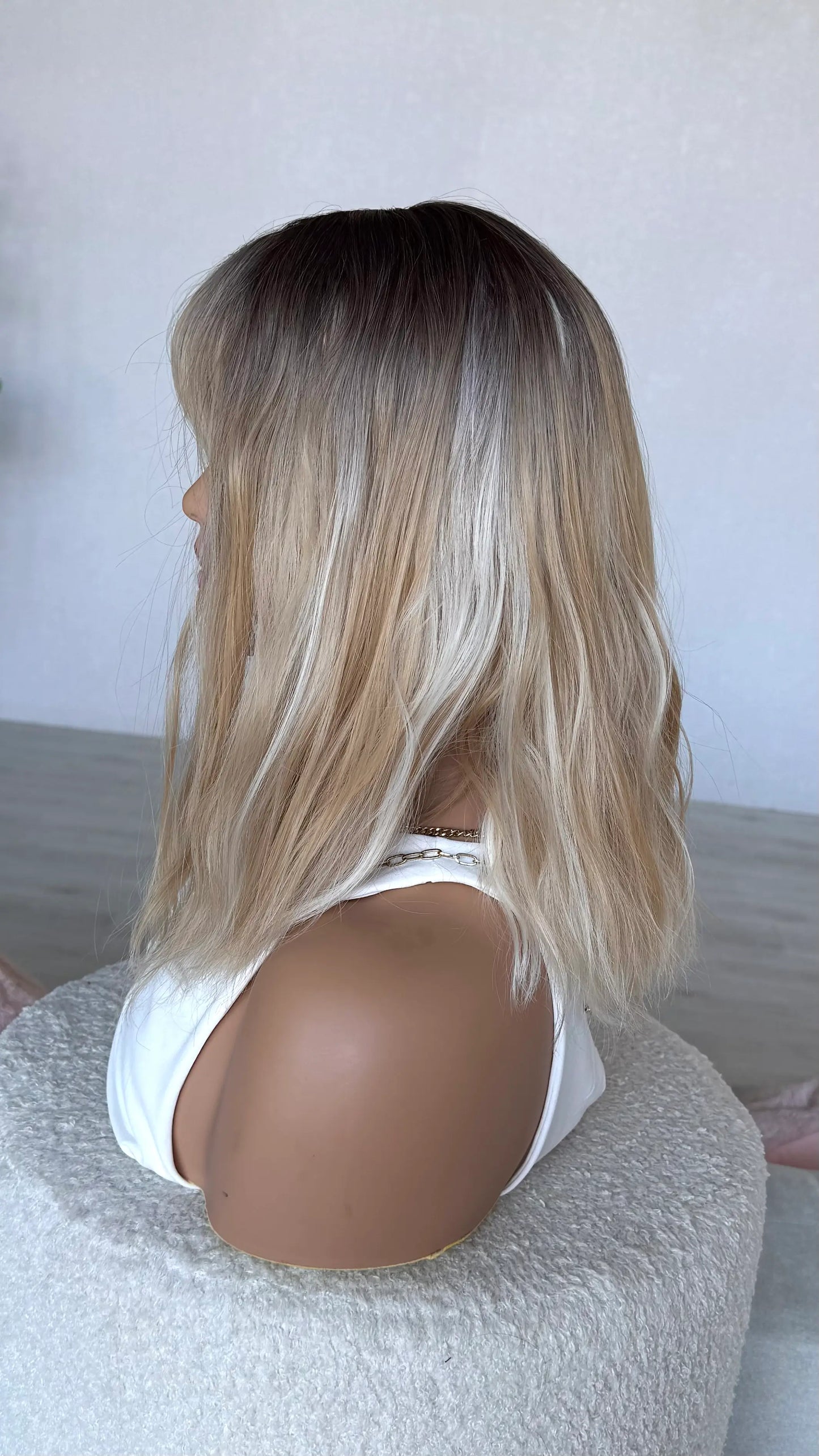 left side view, synthetic wig, dark to light blonde hair, heat safe wig.