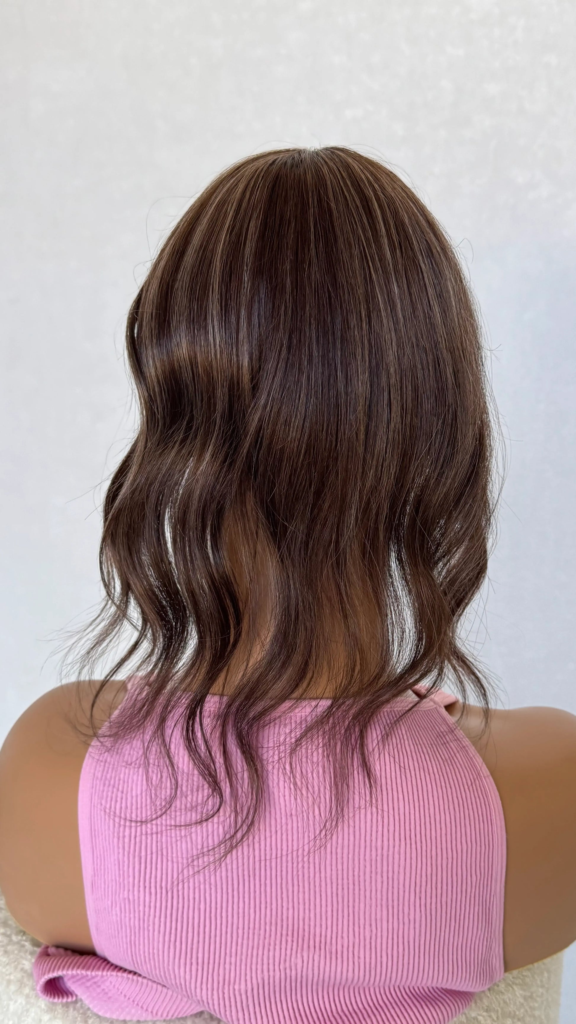 14 inch small topper from behind, slight curl middle part