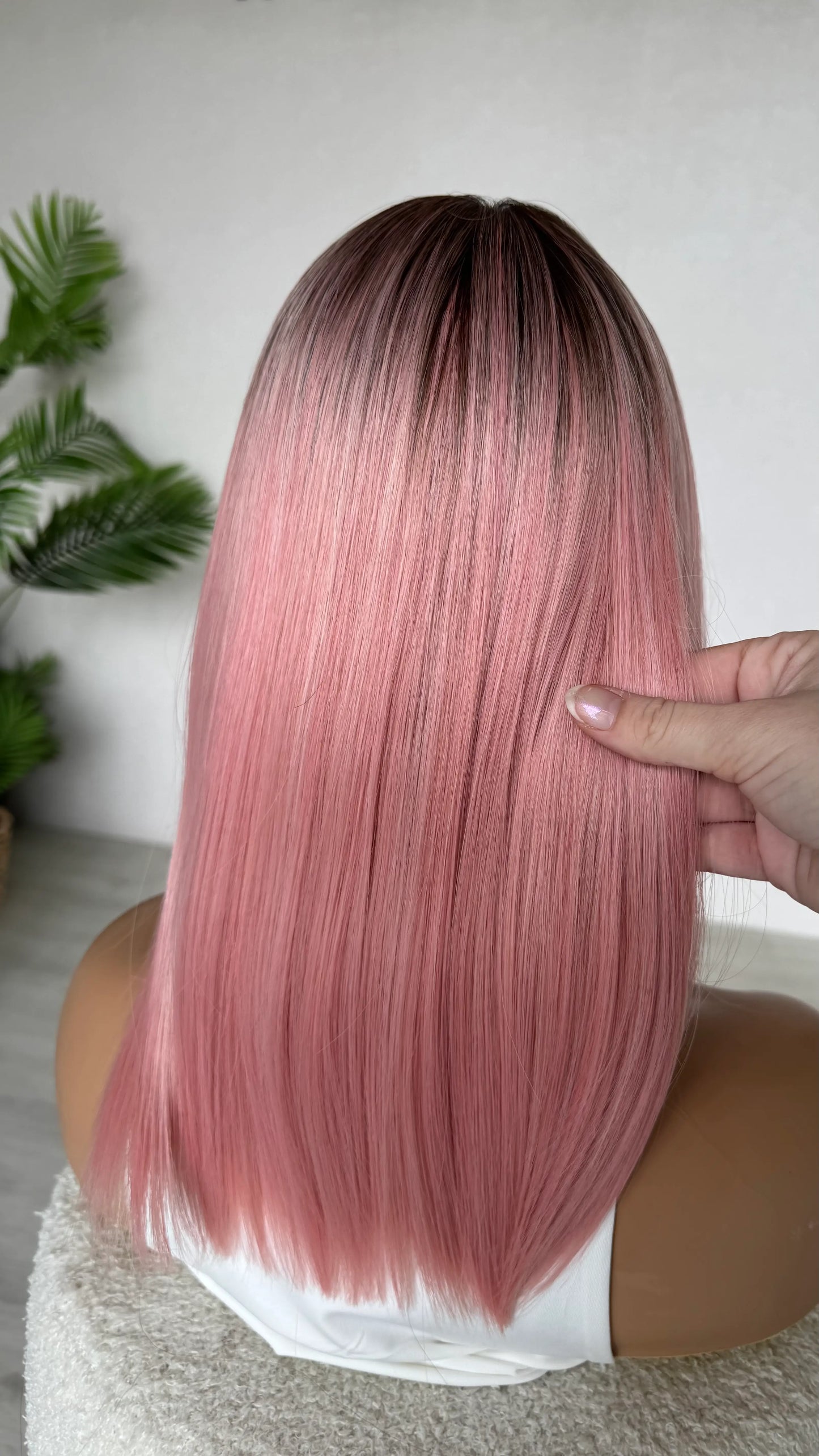 back view holding pink ombre hair straight hair wig