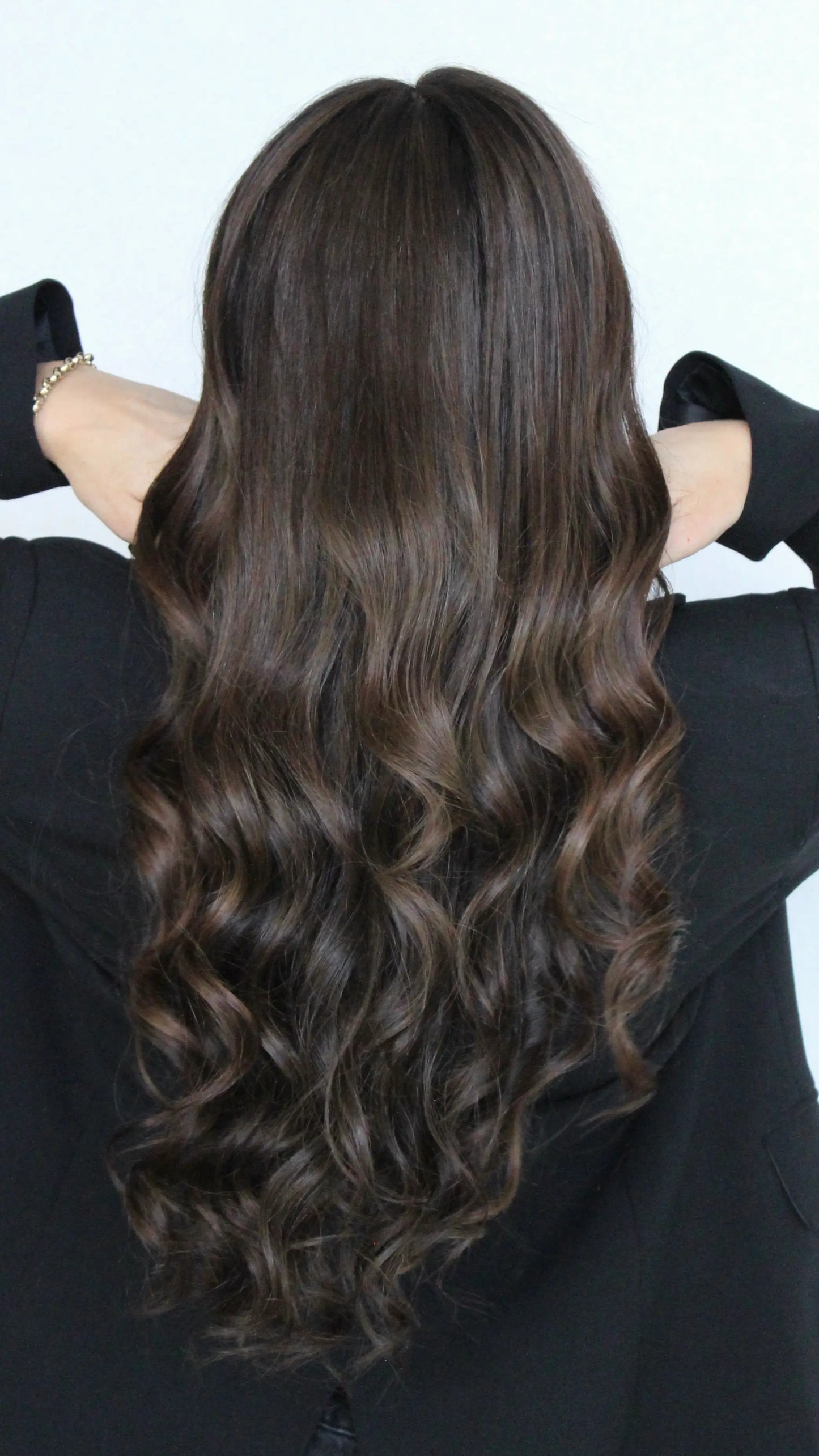 back view, long kai wig, dark brown hair with warm highlights around face. curly hair, lacefront human hair wig australia.
