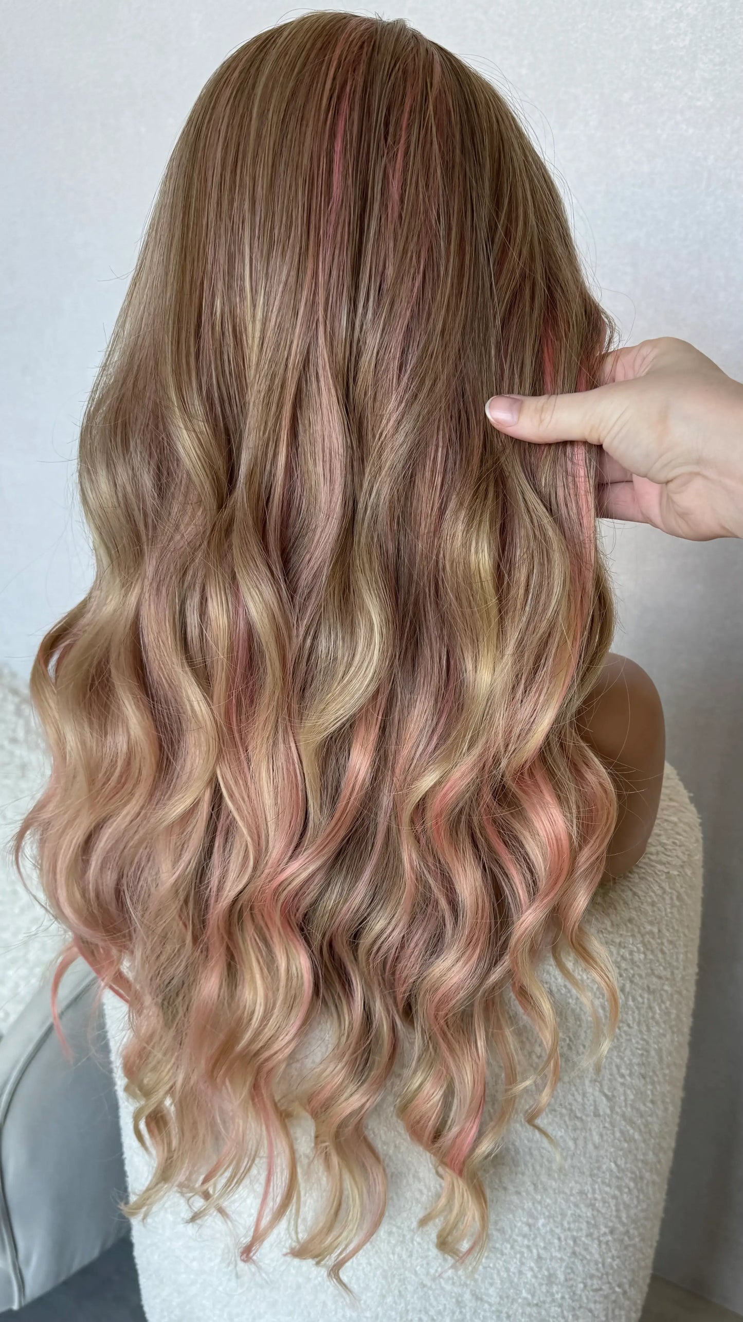 back view long pink and blonde hair synthetic wig, holding hair from behind.