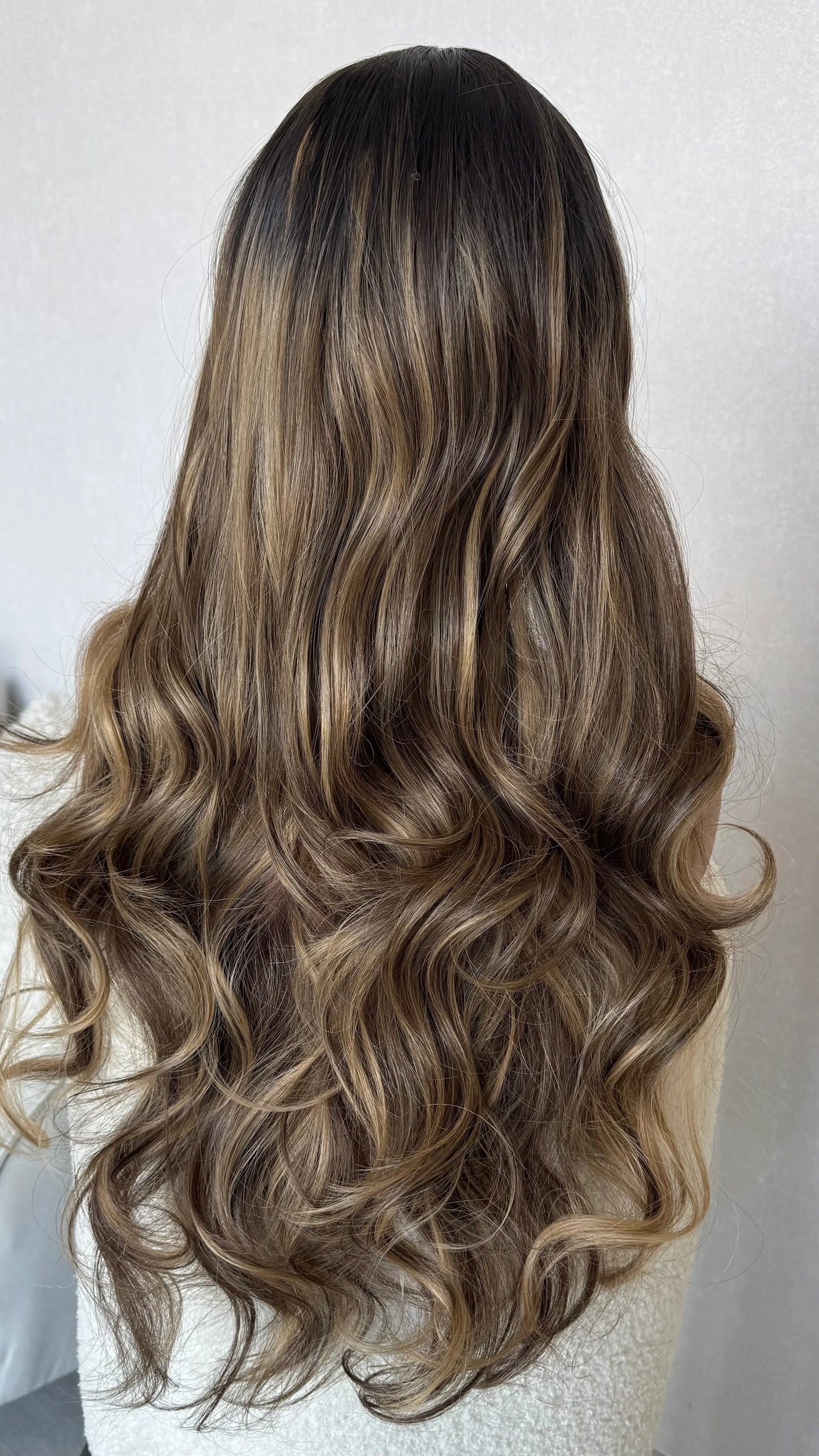 back view long lacefront, dark brunette with highlights.
