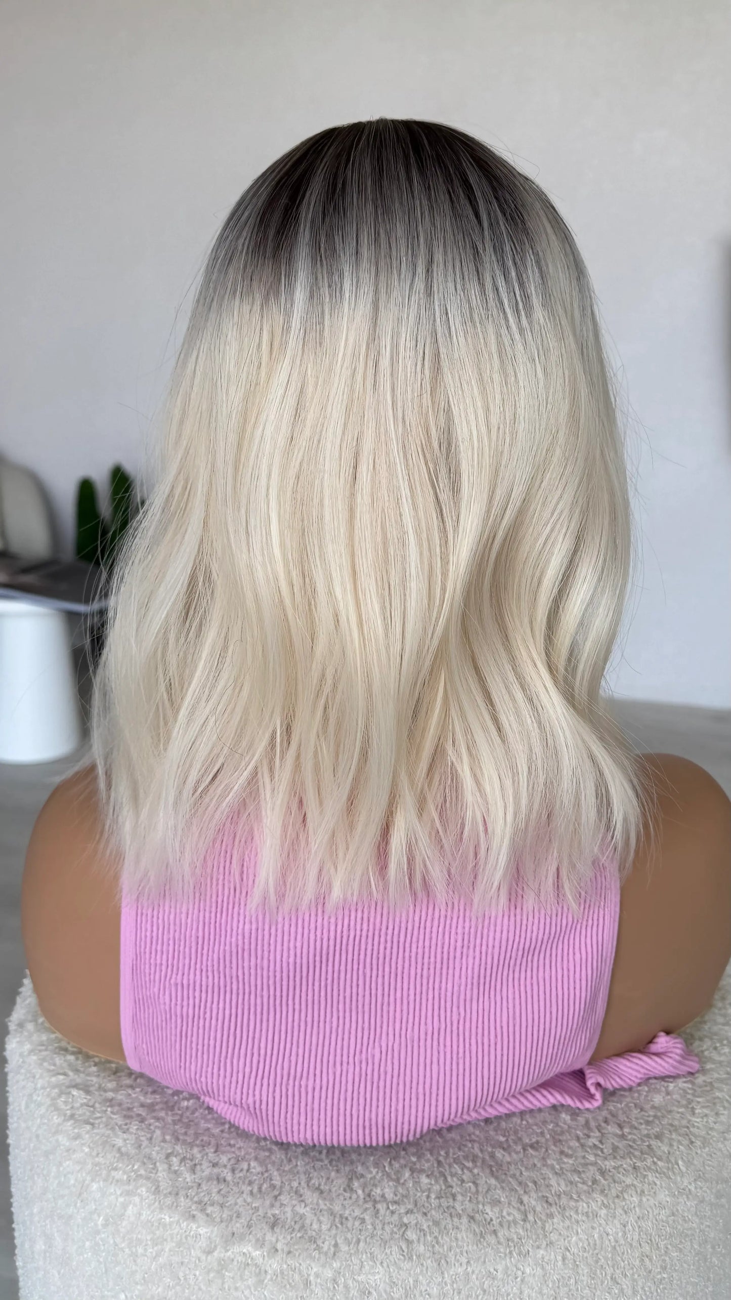wavy fringe wig bob, back view platinum blonde hair.