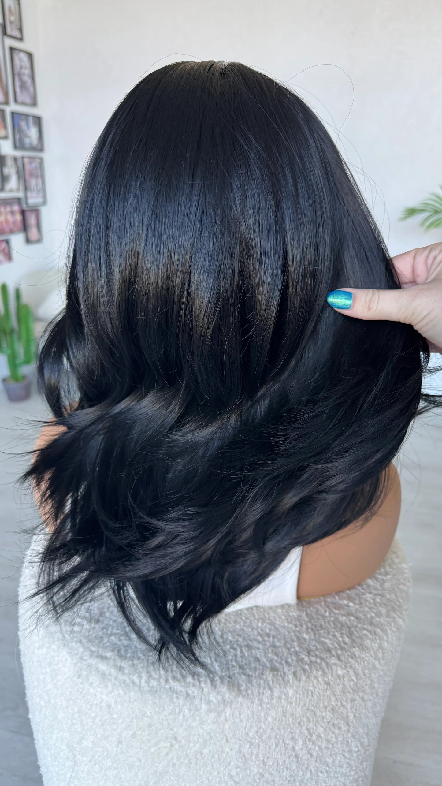 Person with long, blue black hair, glueless wig.