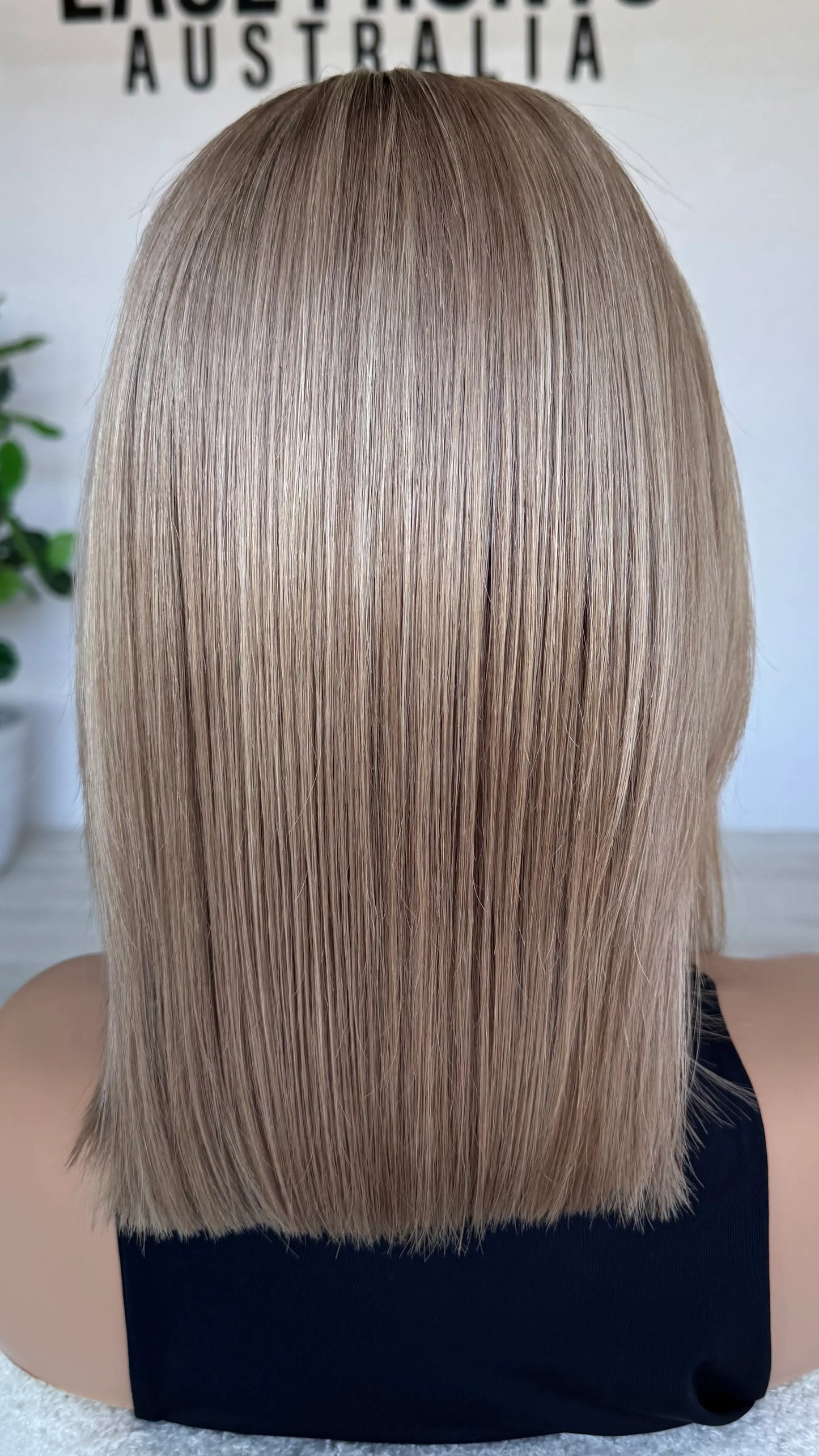blonde wig from the back , natural hair. soft blend of blonde colour.