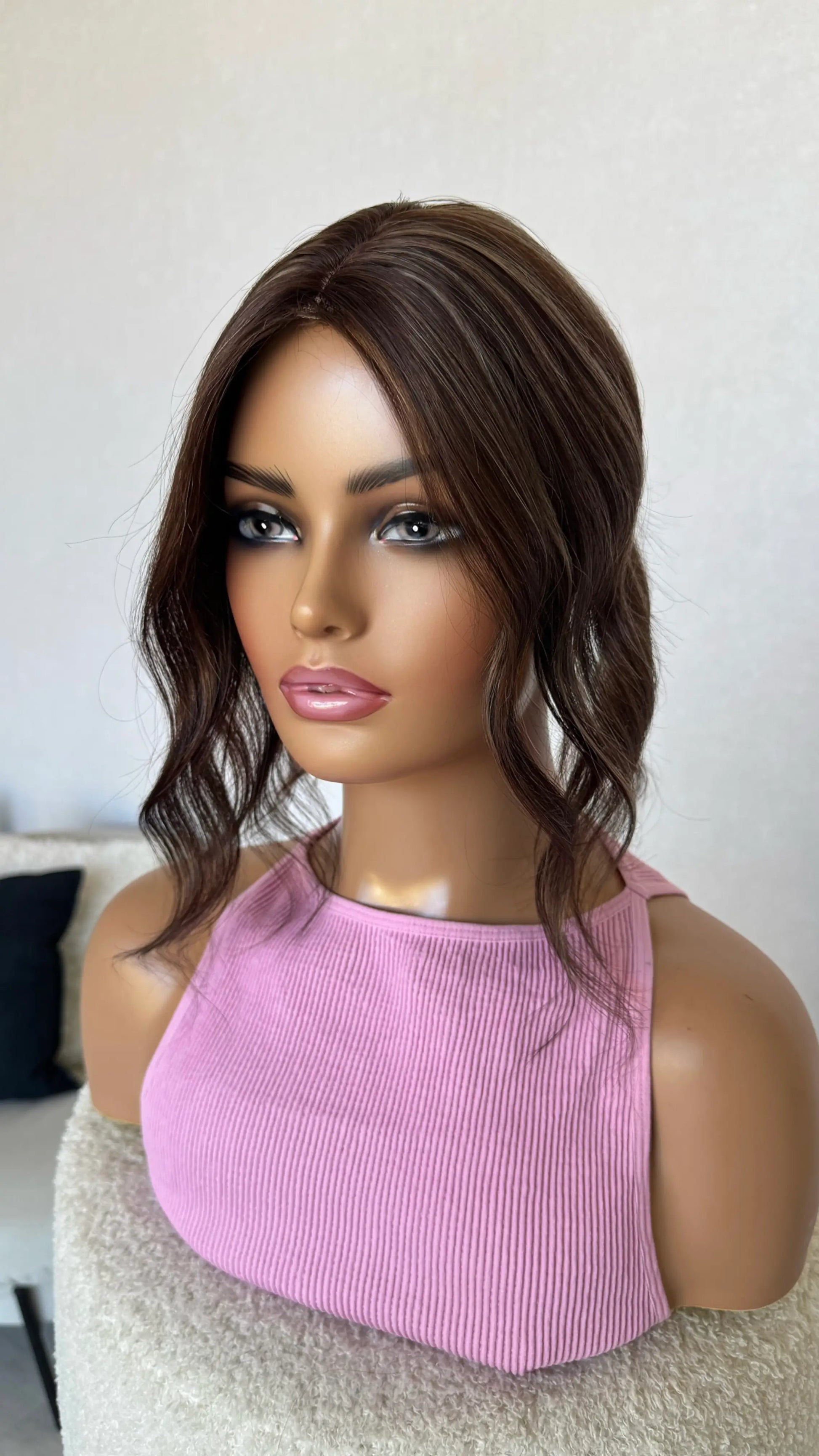 small topper brunette with highlights, middle part curled