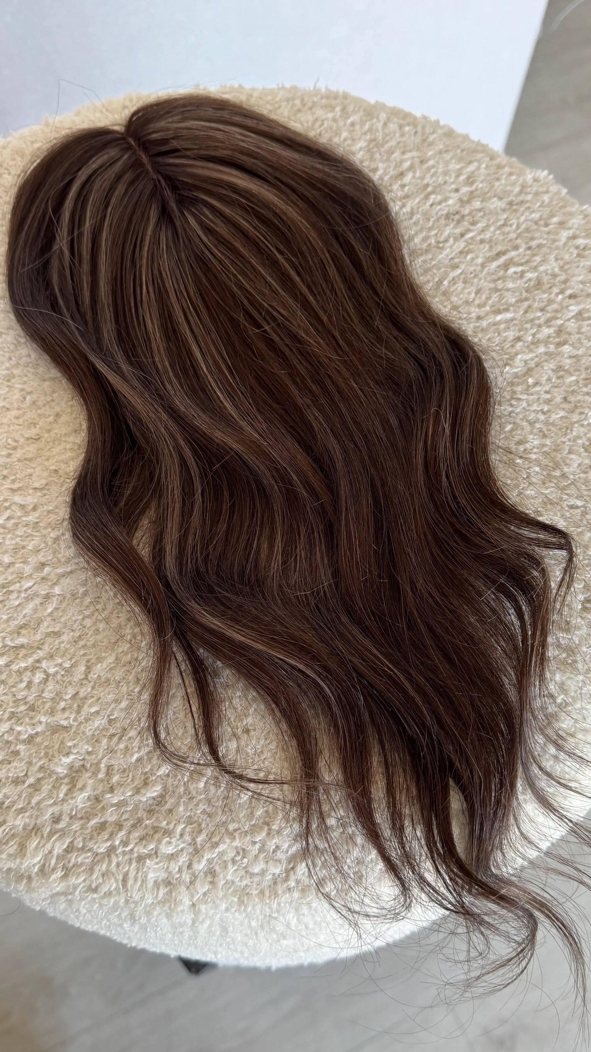 14 inch brunette topper from top view, middle part