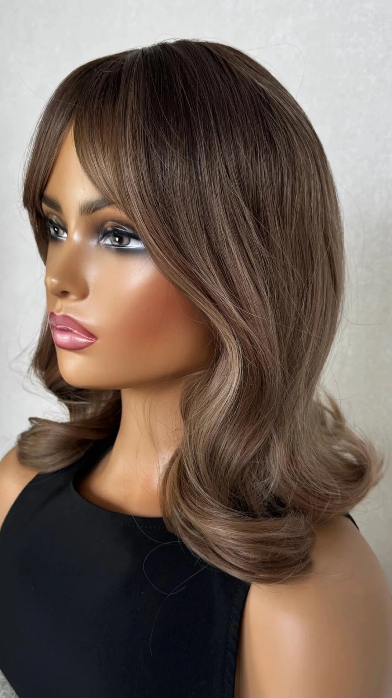 side view curled ends middle part synthetic.