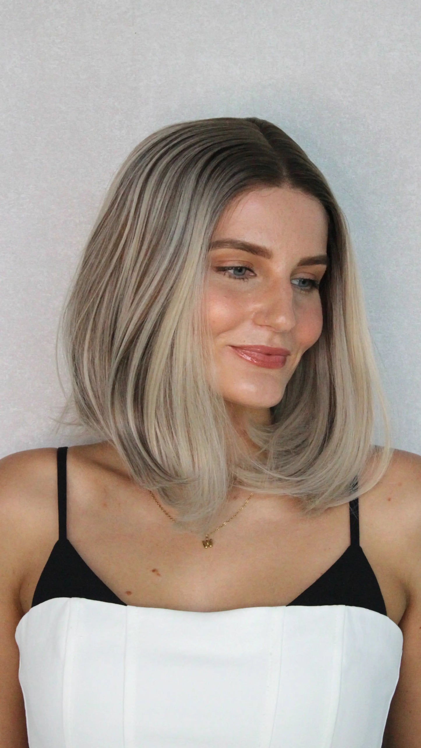 ashy blonde multi-toned synthetic wig, heat safe.