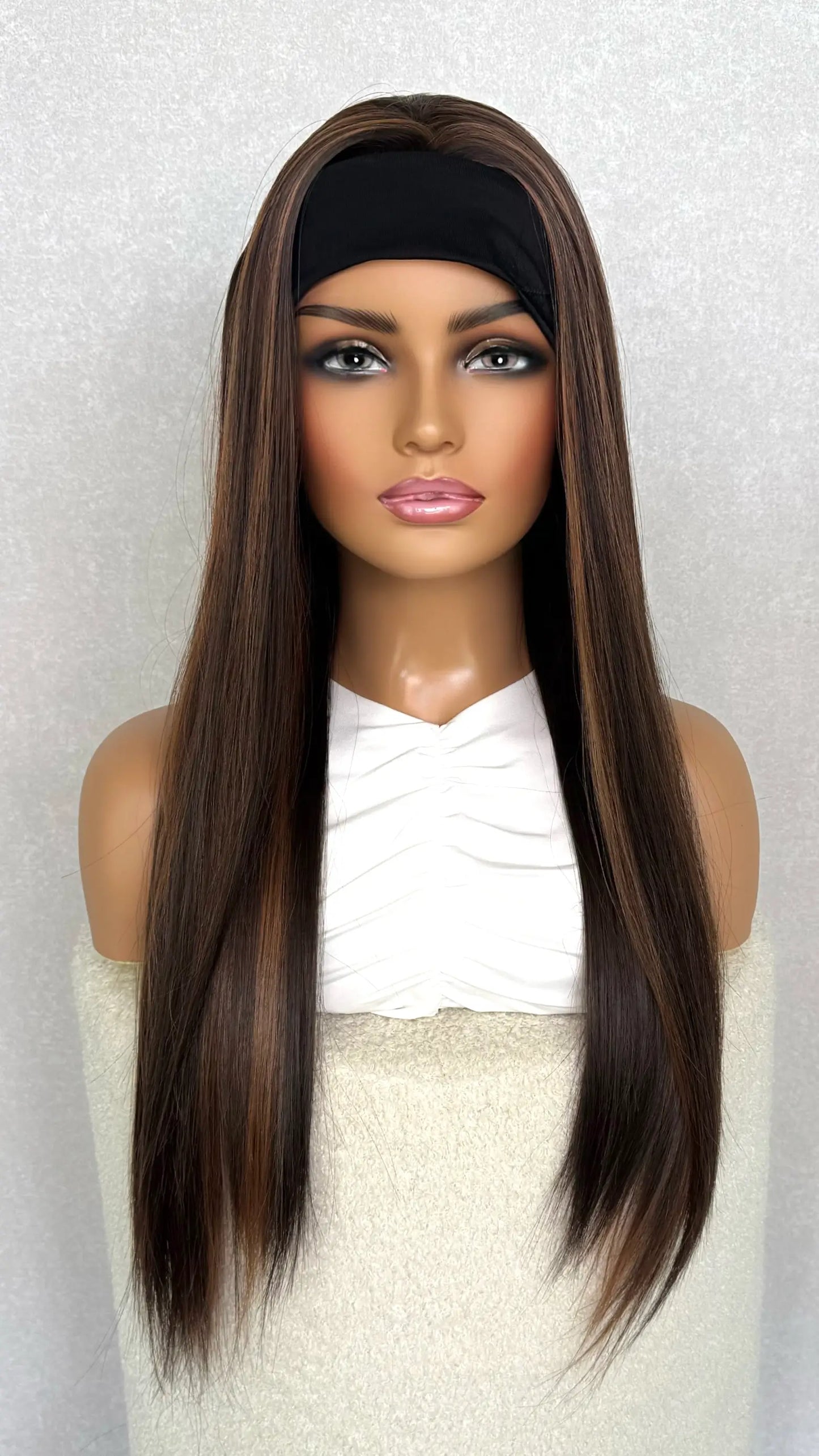 headband wig from the front view. stunning brunette with copper highlightds, heat friendly synthetic.