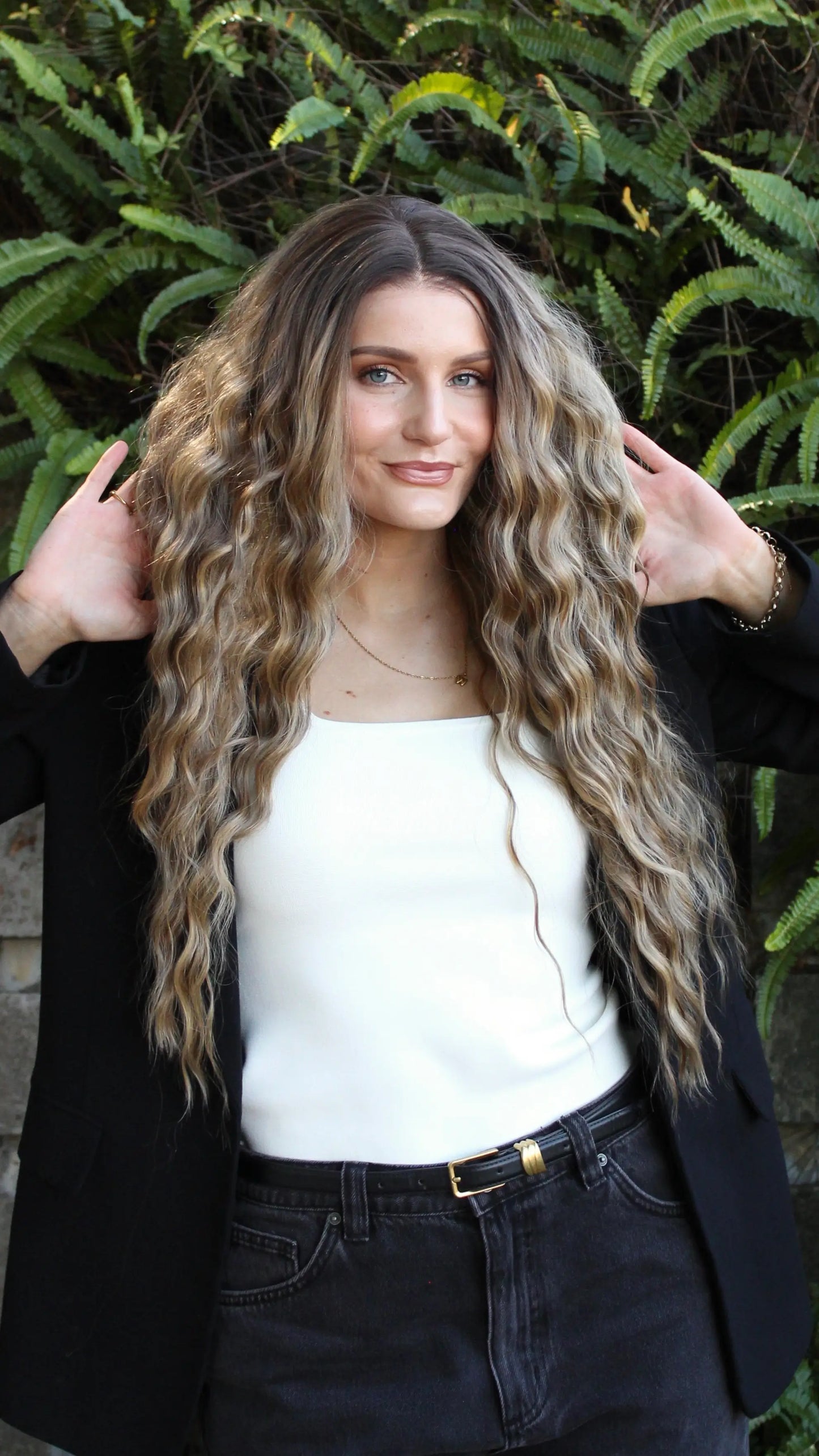 Heat safe synthetic hair, long lacefront wavy hair wig, middle part with highlights.