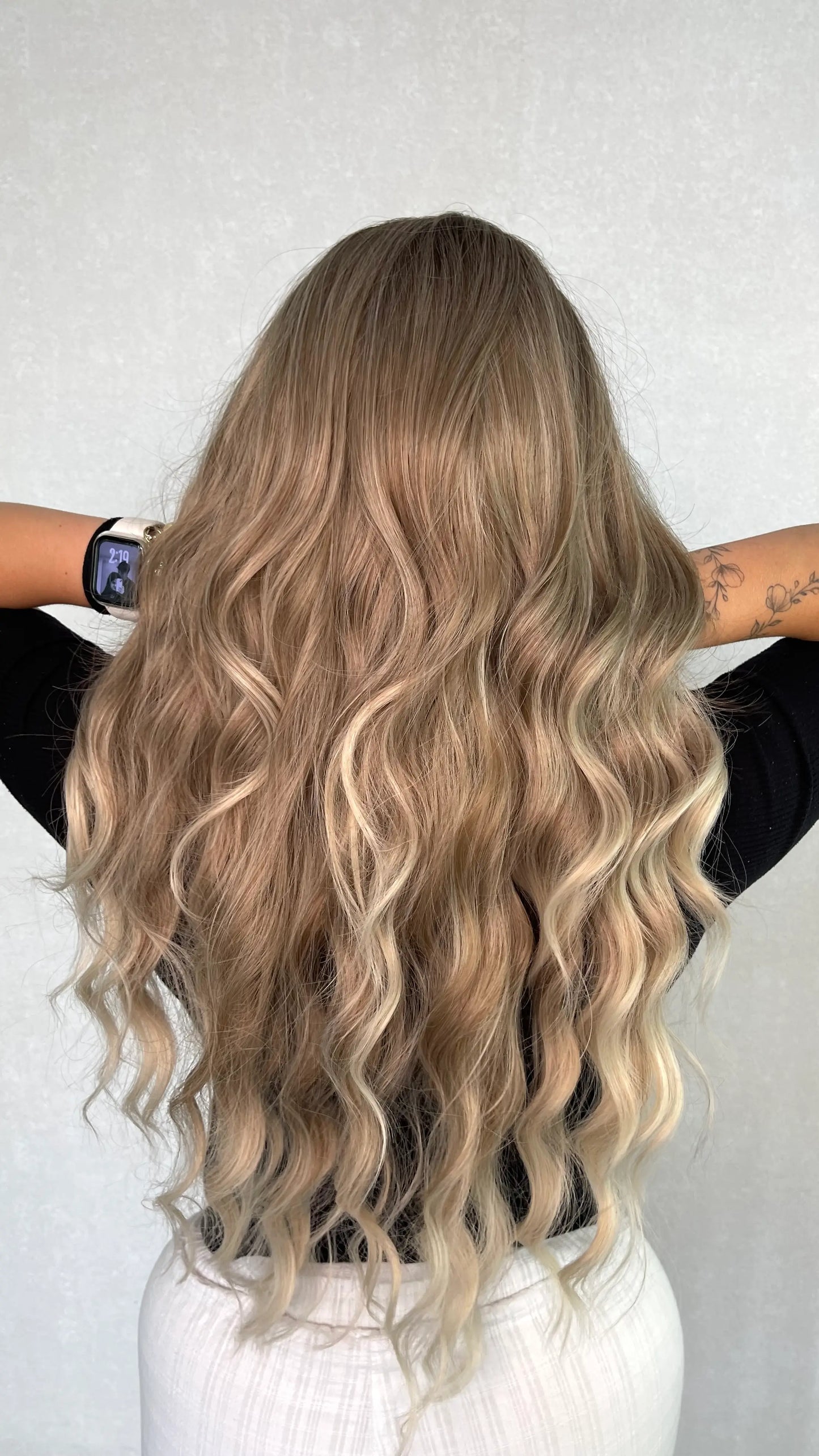 syntheic wig from the back , natural ash hair colour. balayage