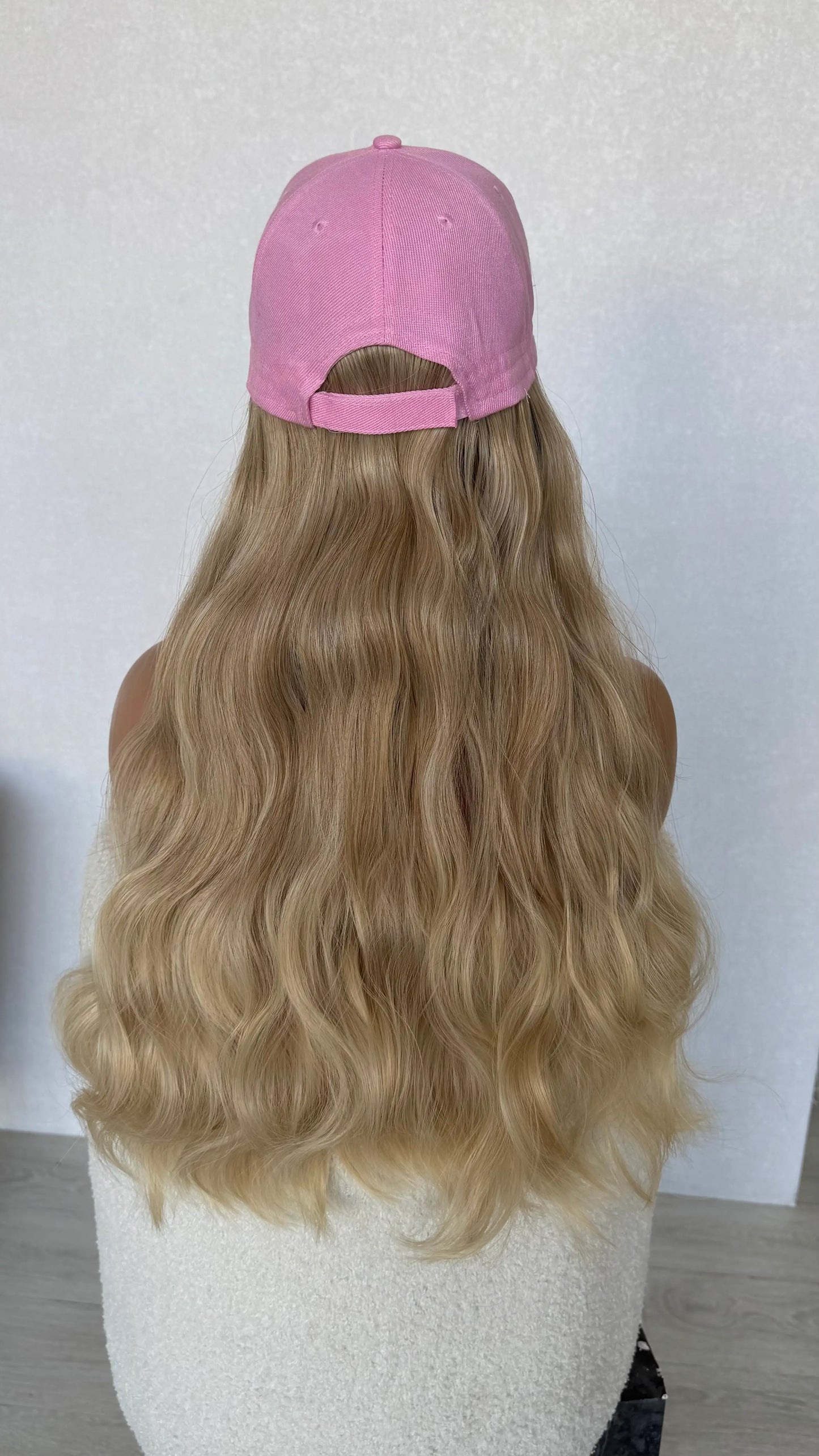 from behind long wavy blonde hair, hat wig.