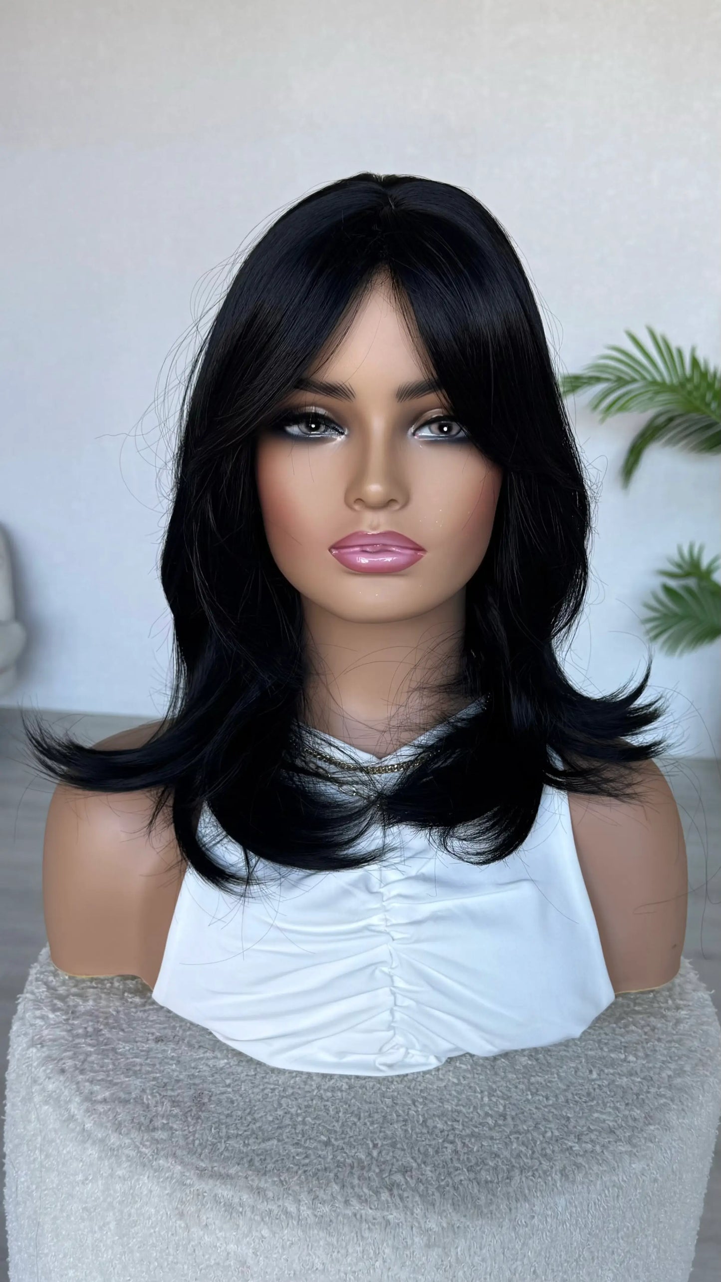nova- black synthetic wig with layers and curtain bangs. australia wigs.