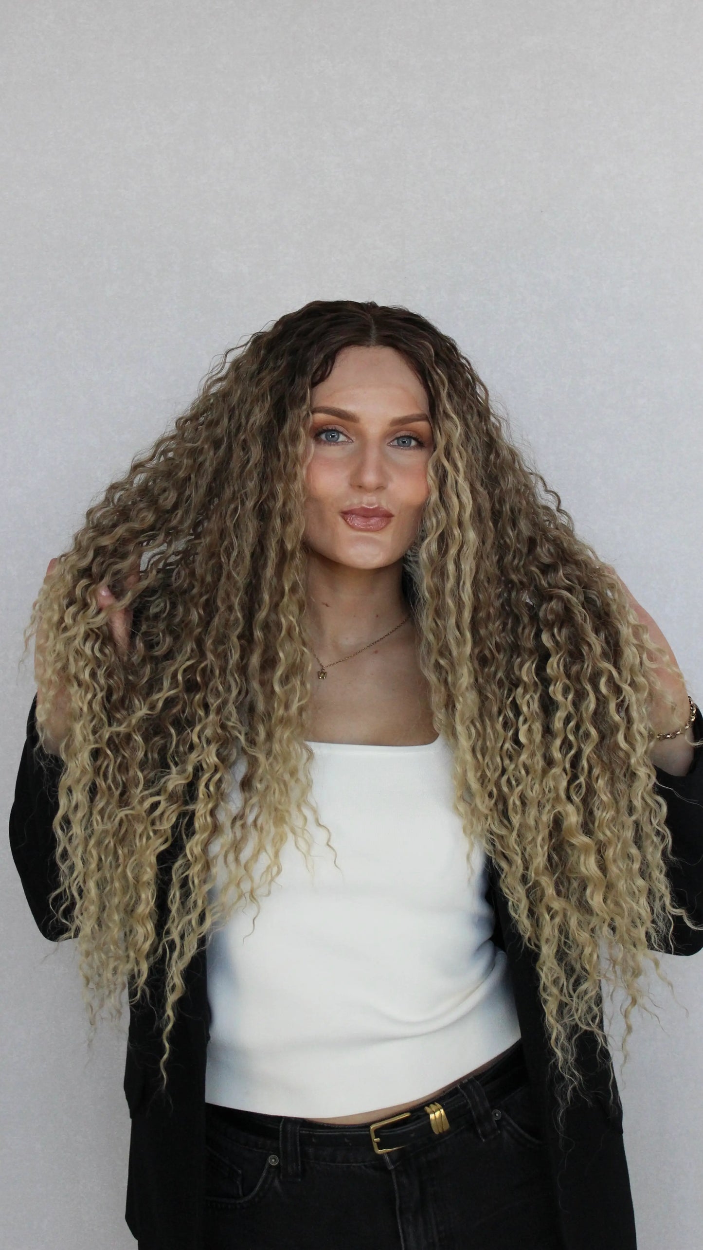 lacefront curly wig, synthetic hair, brown to ombre blonde, middle part.