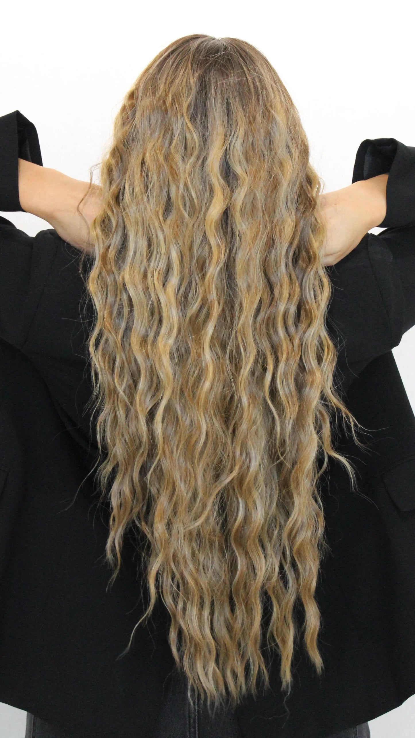 long lacefront wig from behind, wavy brunette hair with highlights.