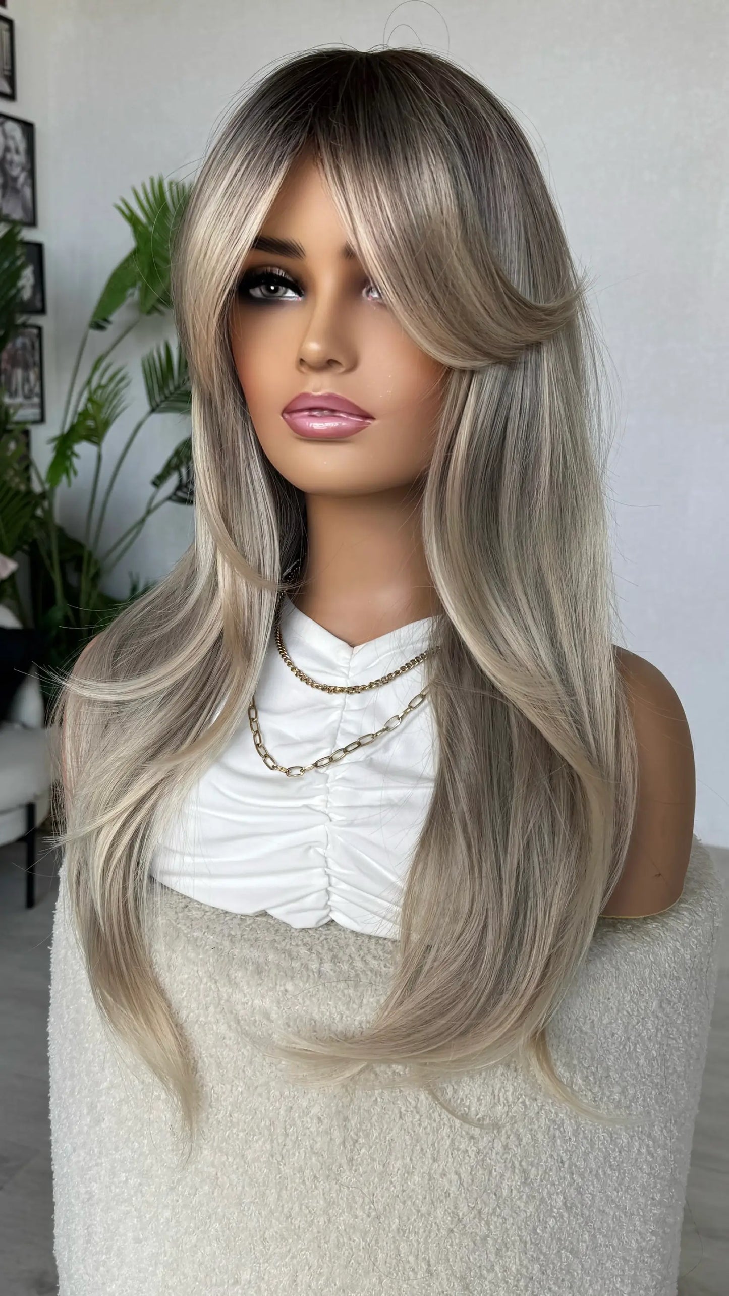 ash ombre colour, 24 inch length with layers and curtain bangs, heat safe synthetic hair.