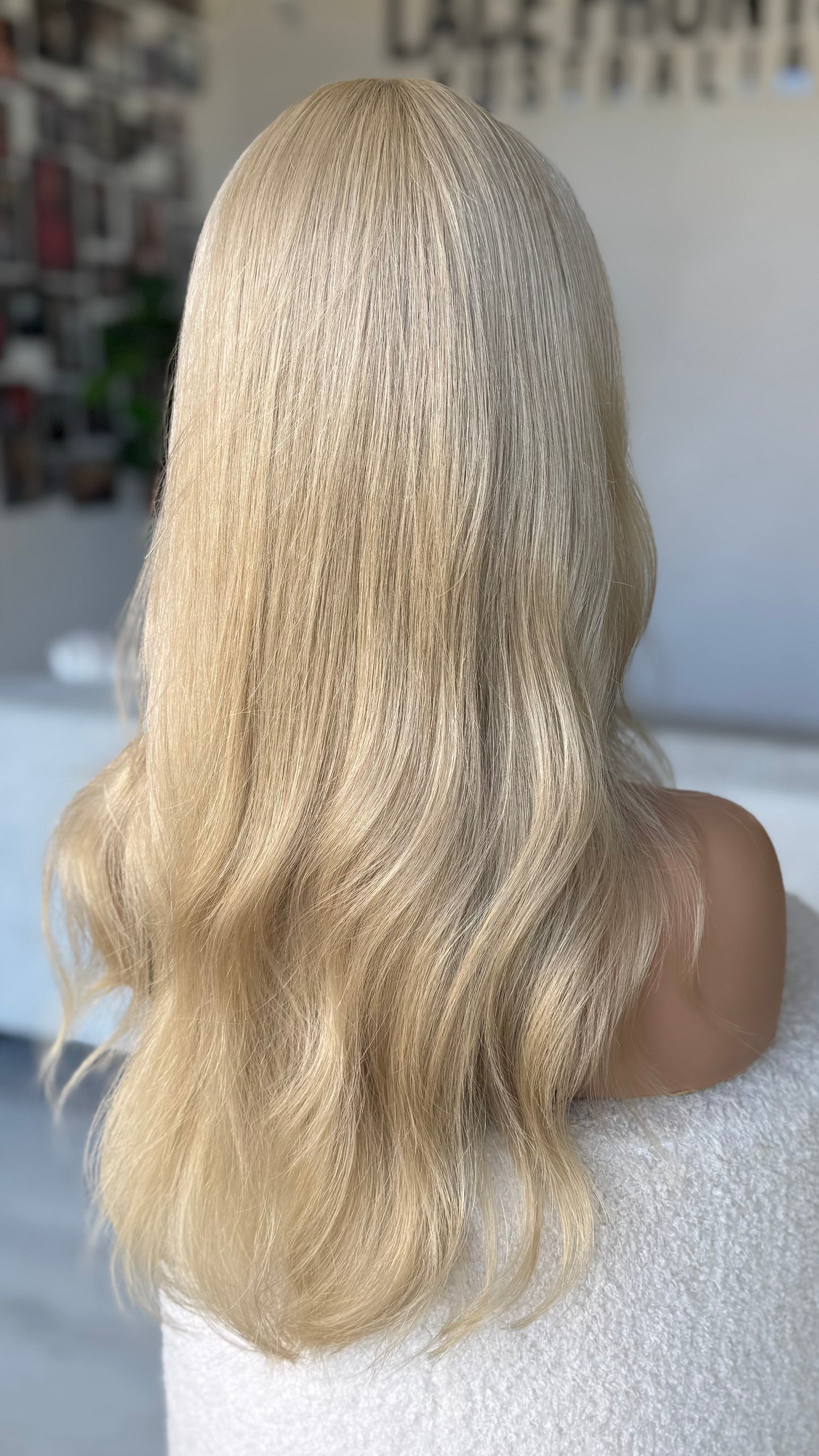 blonde hair wig from the back view, light sandy blonde human hair. natural lacefront wigs. australia.