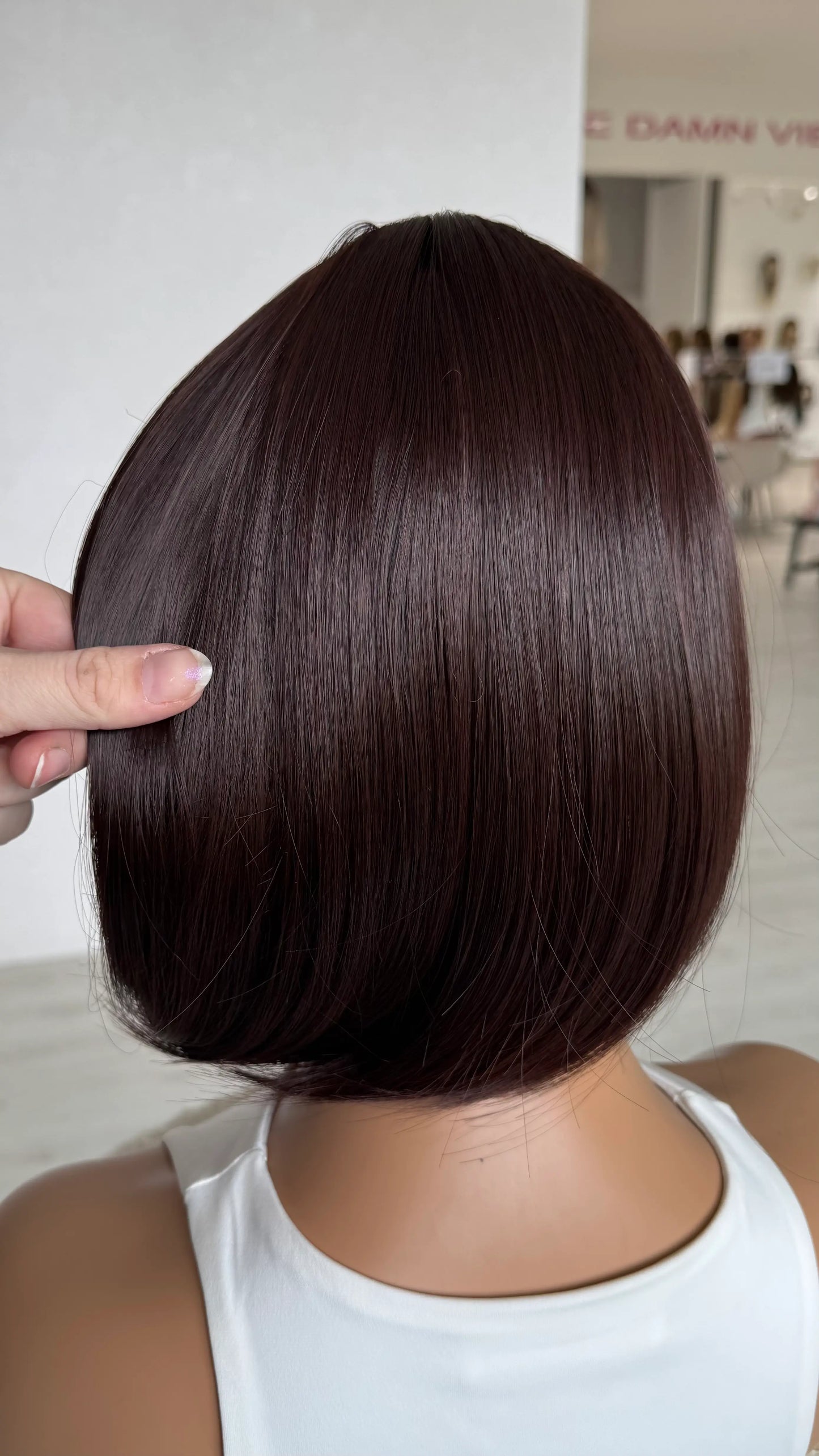 back view holding bob wig, 12 inches red brunette heat safe hair