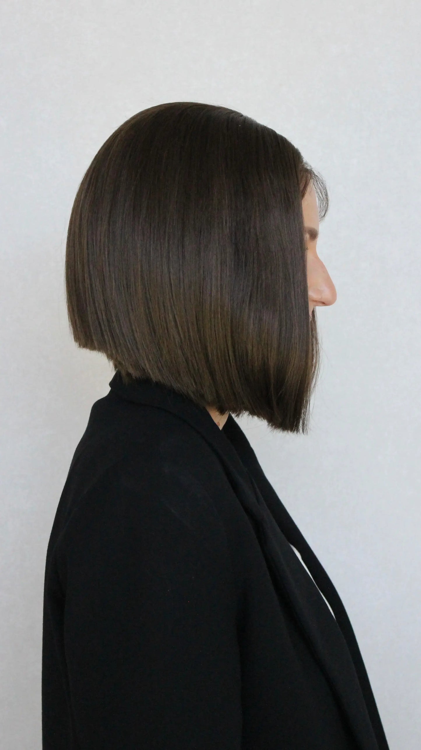 side on view, 12 inch bob, chocolate brown colour, heat safe synthetic hair.