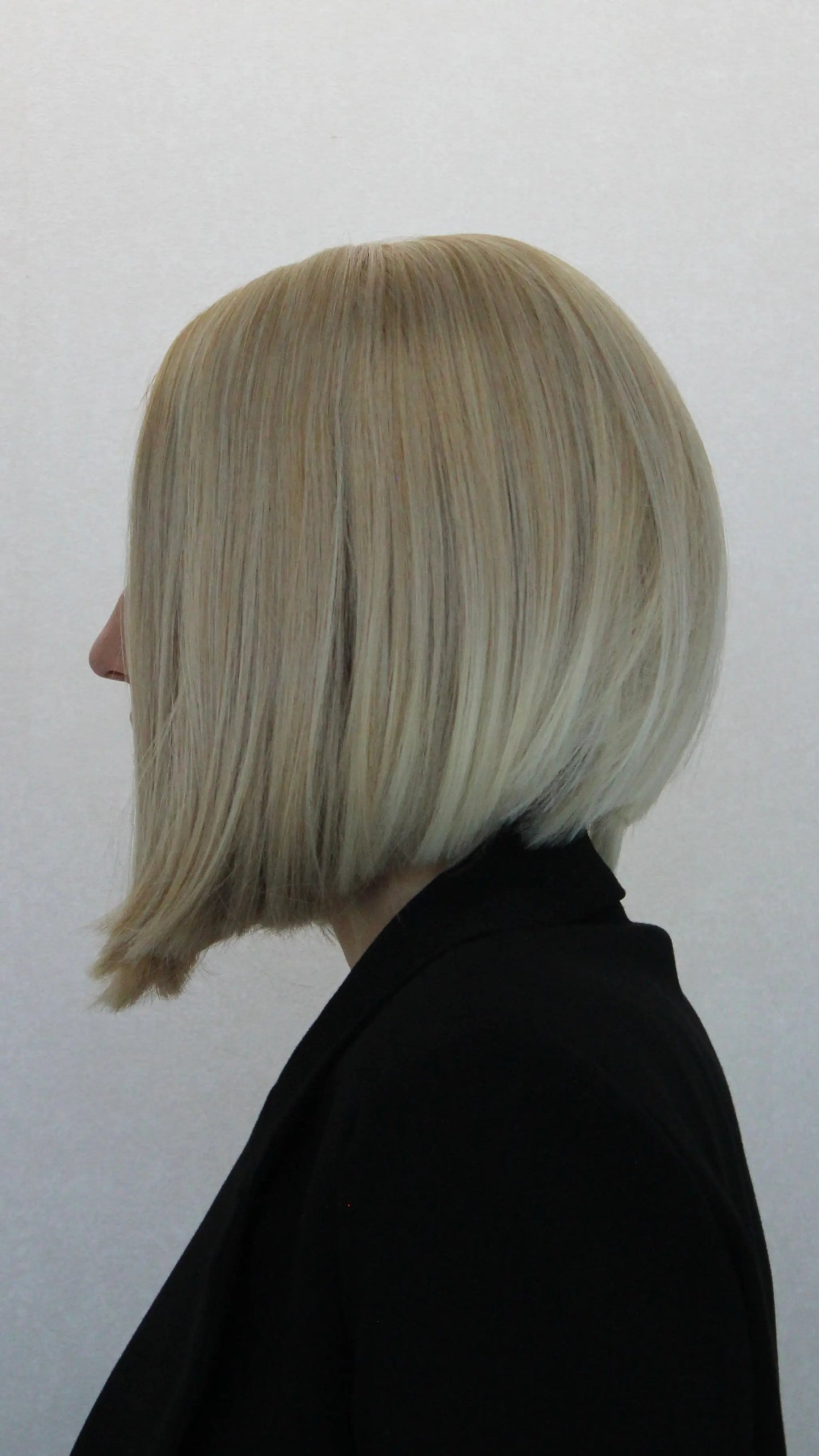 side view blonde bob synthetic, lacefront wig with baby hairs, middle part.