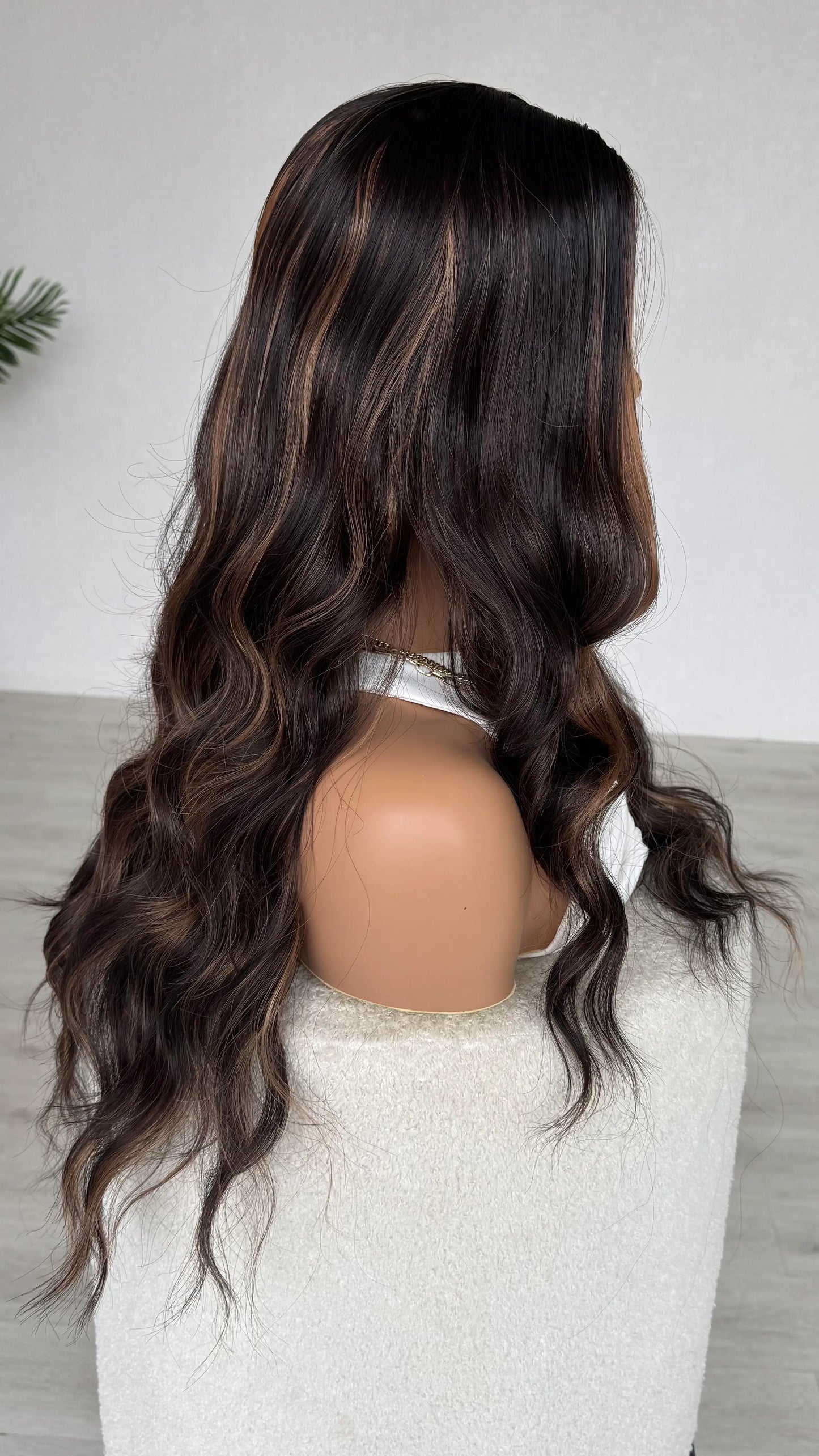 side view, long curly hair vixen. wavy brown hair, long length australia.