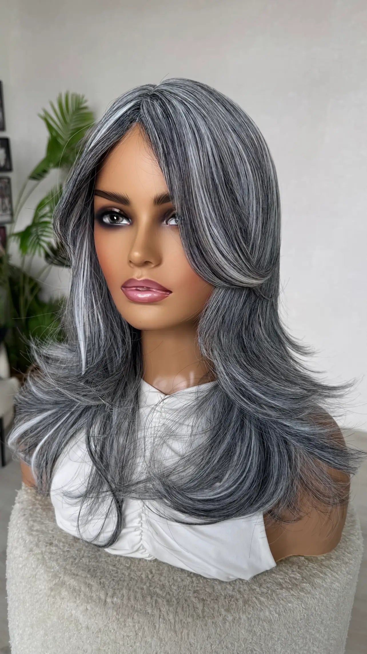 grey salt and pepper wig with curtain bangs and layers, heat safe fibers, synthetic wig.