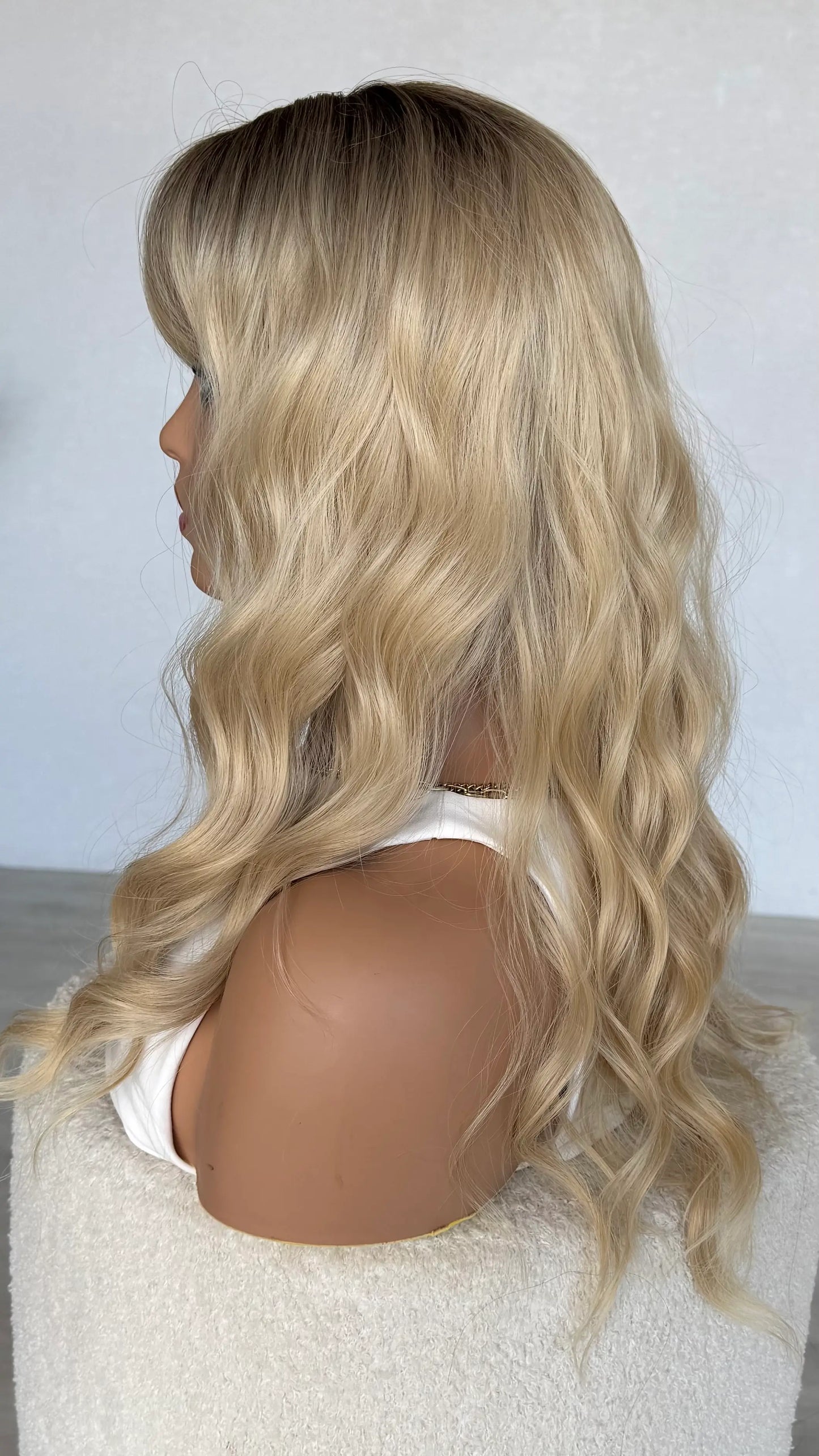 side view, warm blonde ombre hair with waves, 24 inch length, heat safe synthetic hair australia.