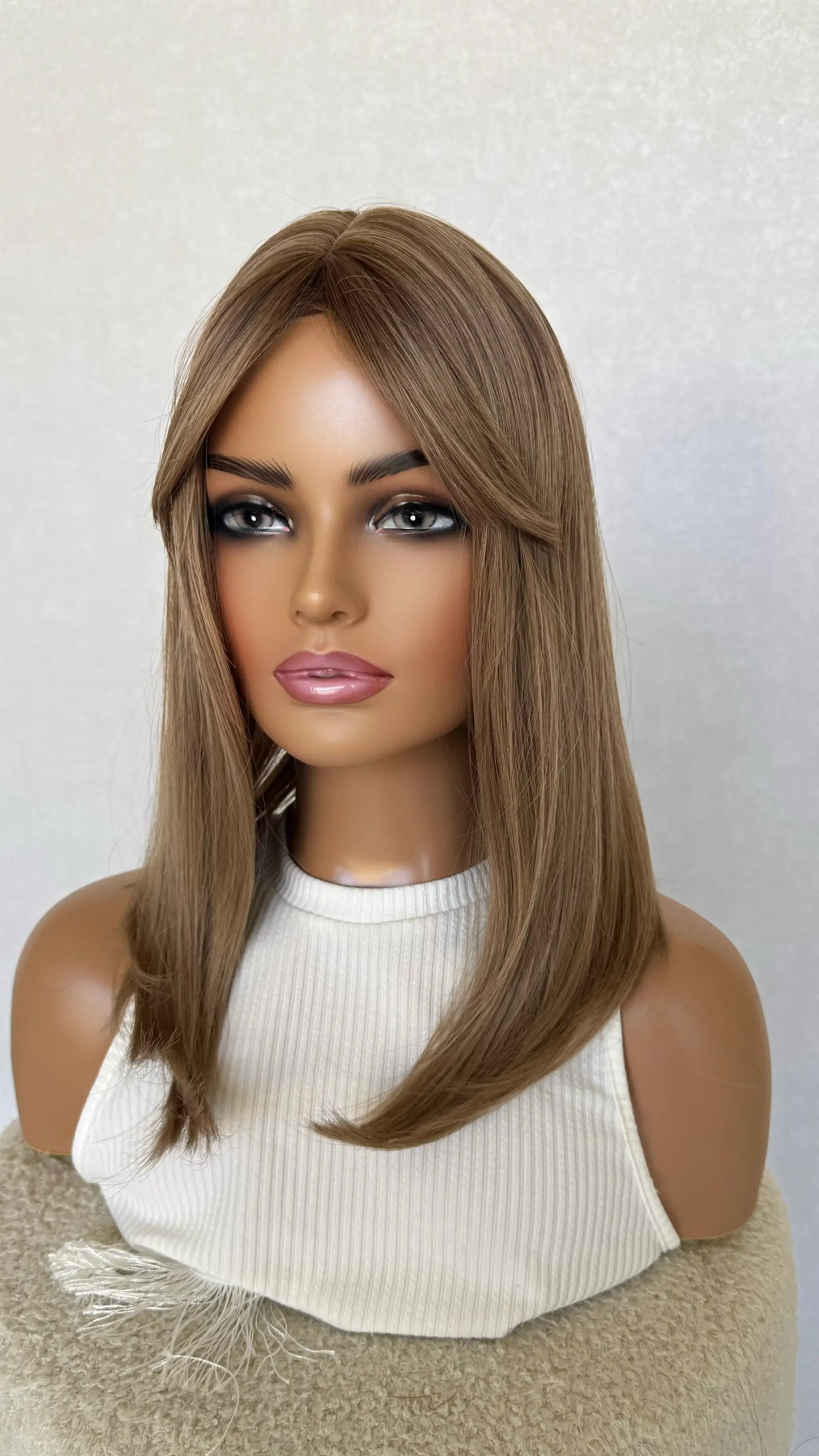 dark blonde, middle part, fringe parted to the side, heat safe, glueless wig.