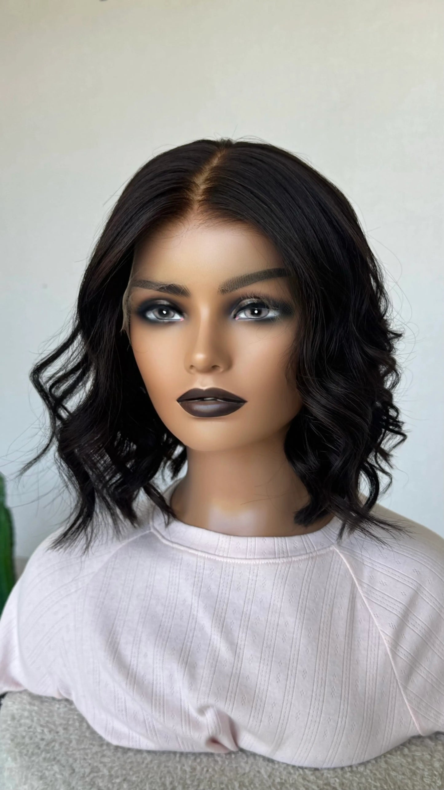 lace front human hair wig, medical glueless cap australia wigs. dark brown hair middle part, styled with curls.