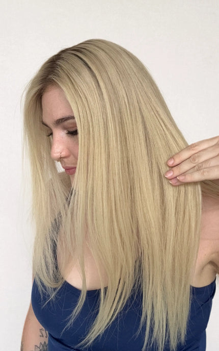 human hair wig, creamy blonde with darker root hair, 22 inch length wig.