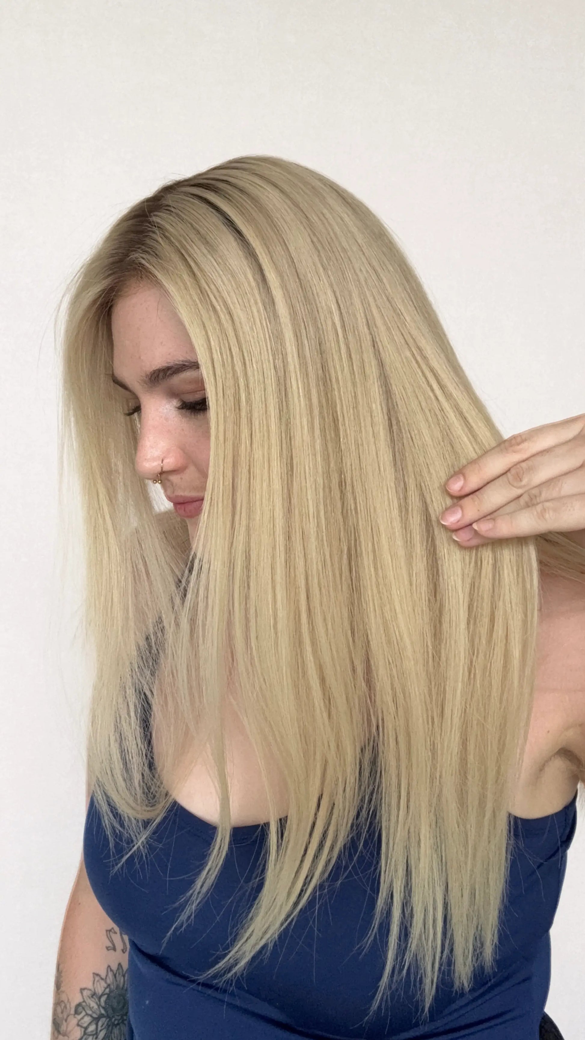 human hair wig, creamy blonde with darker root hair, 22 inch length wig.