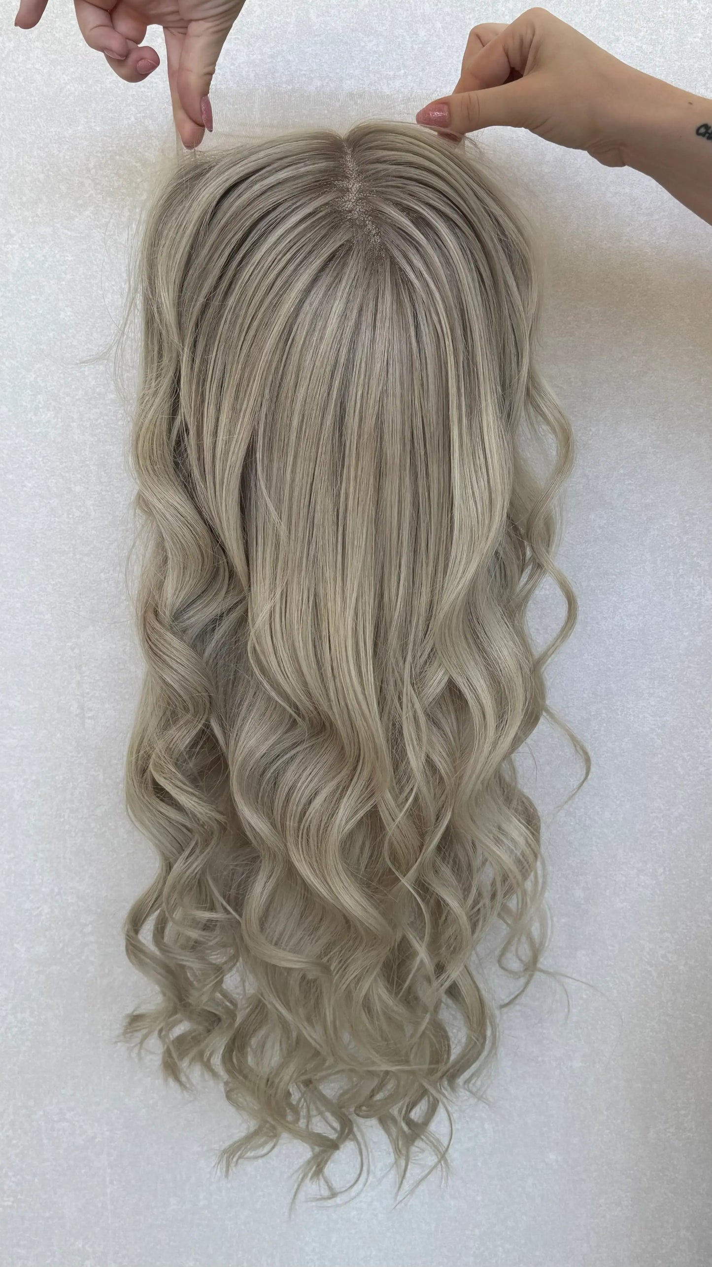 lace front wig australia, 26 inch curled hair, platinum blonde with fine lowlights at root.