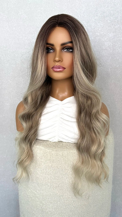 ash blonde wig from the side. showing the ombre ash colour with face framing highlights. heat friendly synthetic wig.