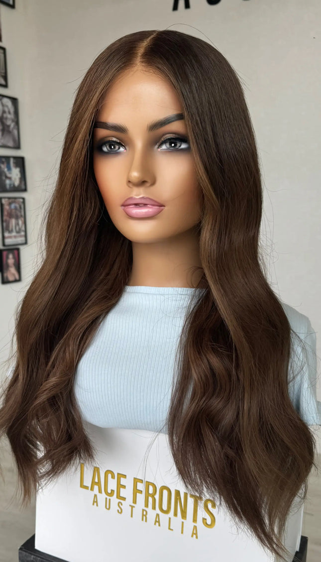 A 24-inch human hair lace front wig in rich chocolate brunette wavy hair lace front wig.