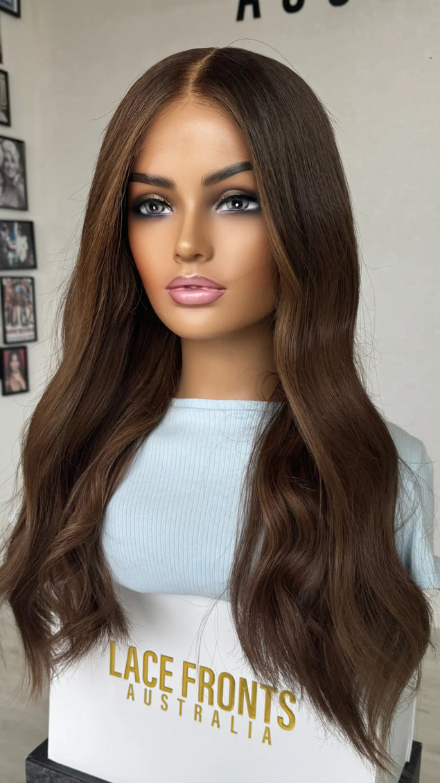 A 24-inch human hair lace front wig in rich chocolate brunette wavy hair lace front wig.