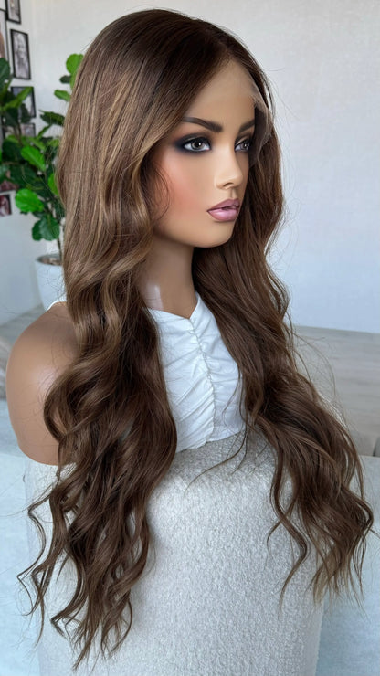 side on view middle part, slight darker root to softr brunette tones.