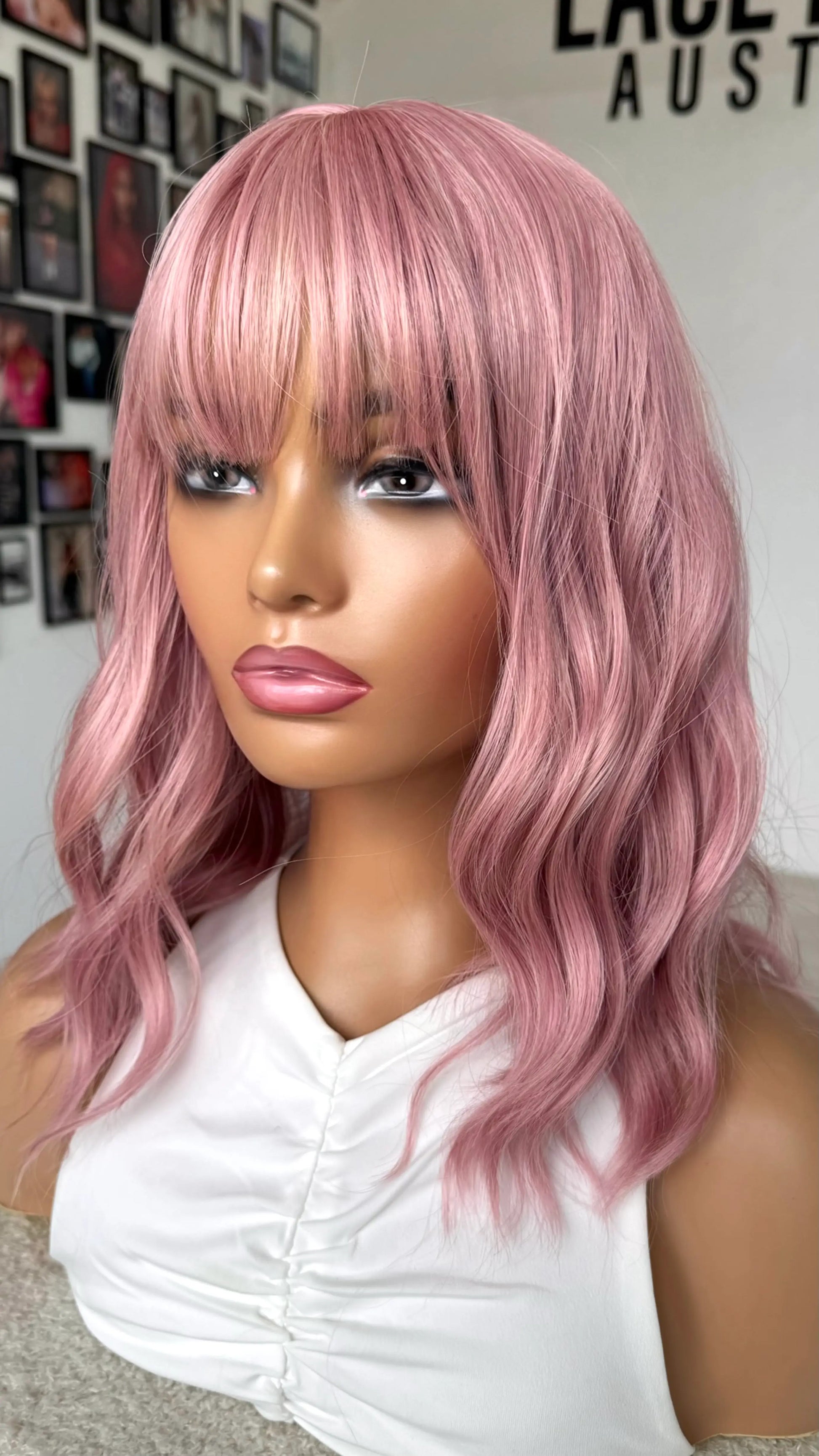 Heat Safe Hair, Pink Hair wavy bob from the side. fringe bob.