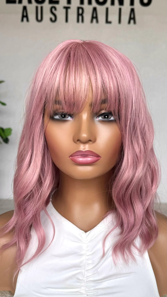 Pearl Pink Wavy Fringe Synthetic - Cotton Candy front view. heat safe synthetic.