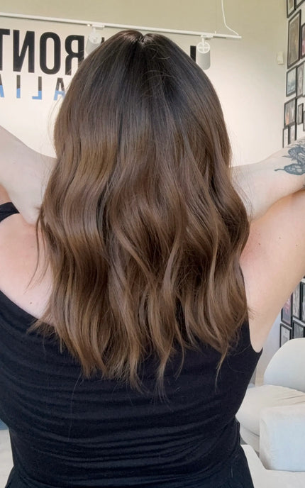 dark brunette ombre wavy hair heat safe topper, middle part with fringe.
