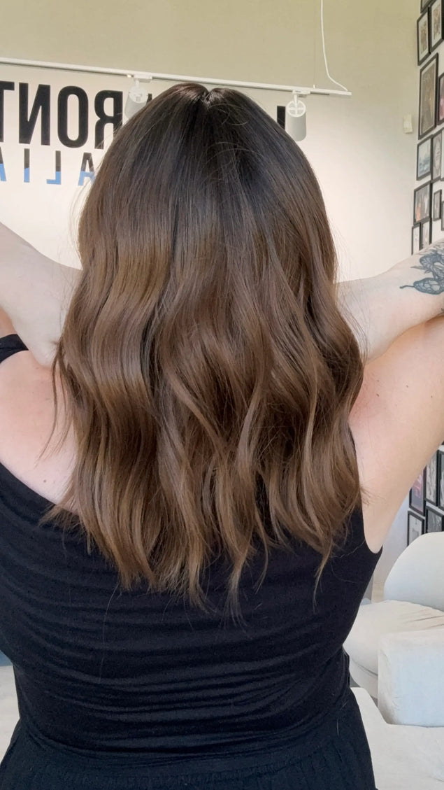 dark brunette ombre wavy hair heat safe topper, middle part with fringe.