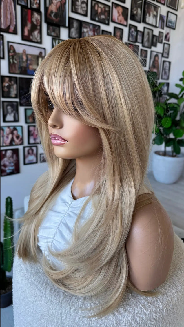 side on view, layered gold blonde hair with darker root, heat safe