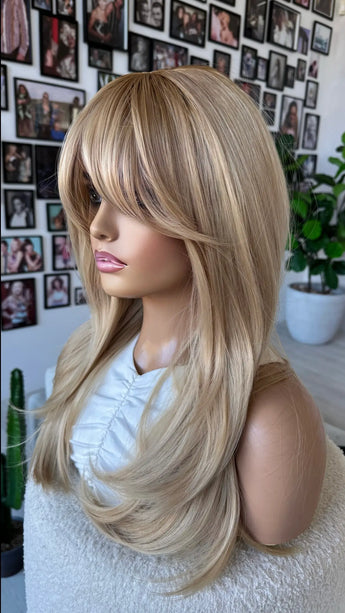 side on view, layered gold blonde hair with darker root, heat safe