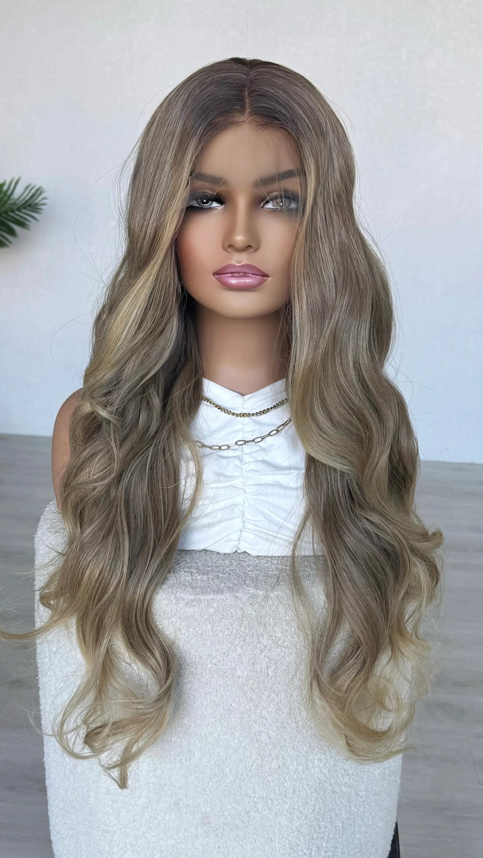 soft honey blonde middle part, ,long length 28 inch hair. heat safe wig.